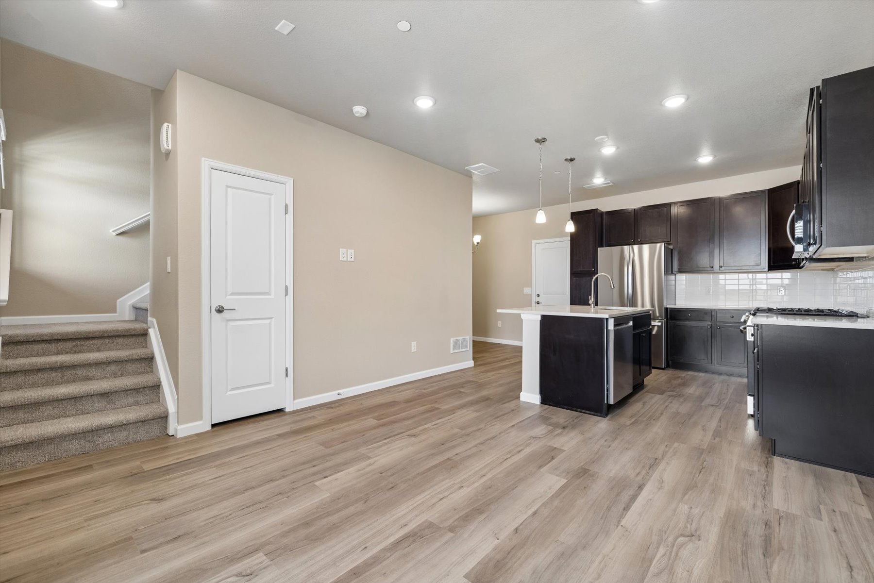 A kitchen with wooden floors.