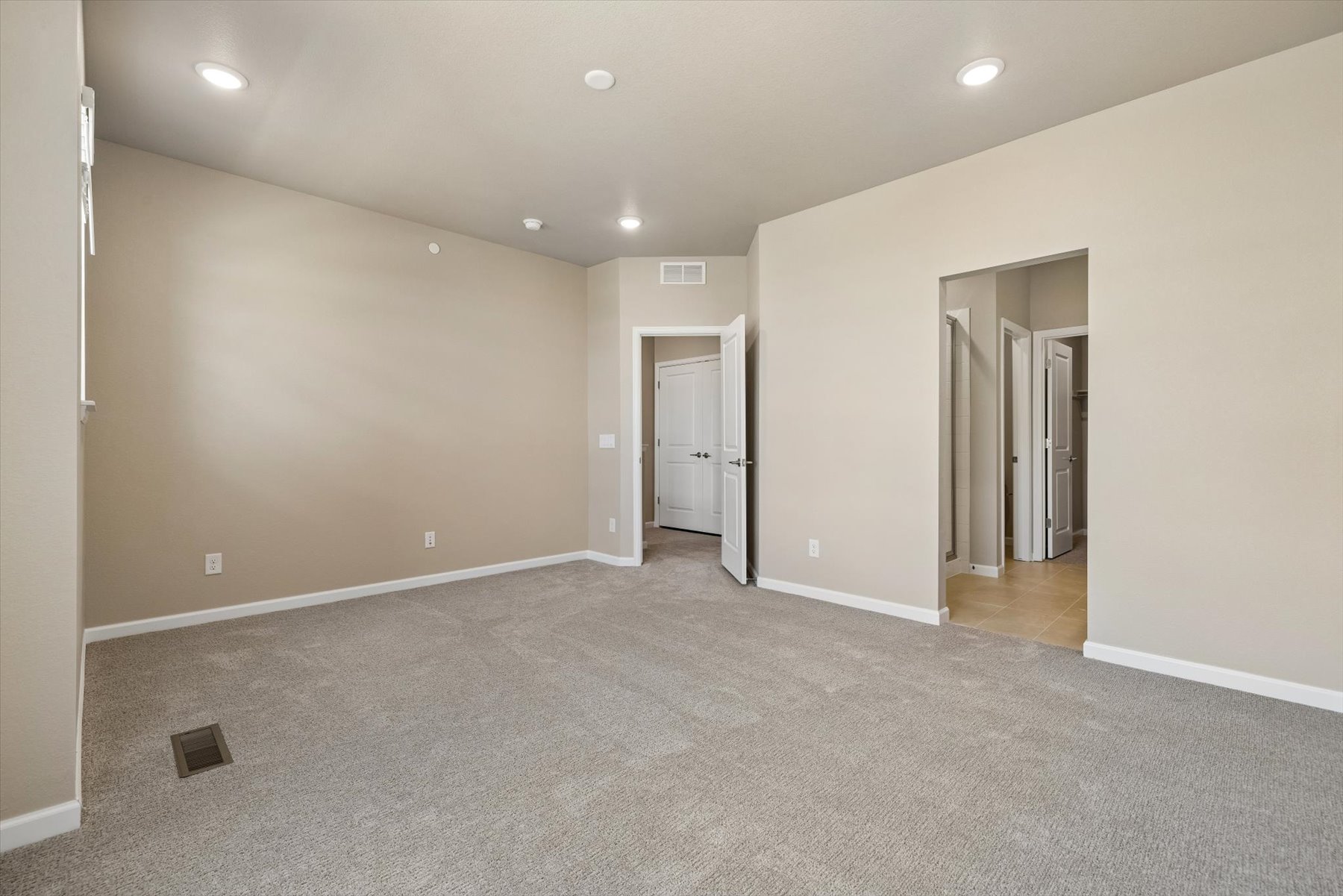 A long hallway with white walls.