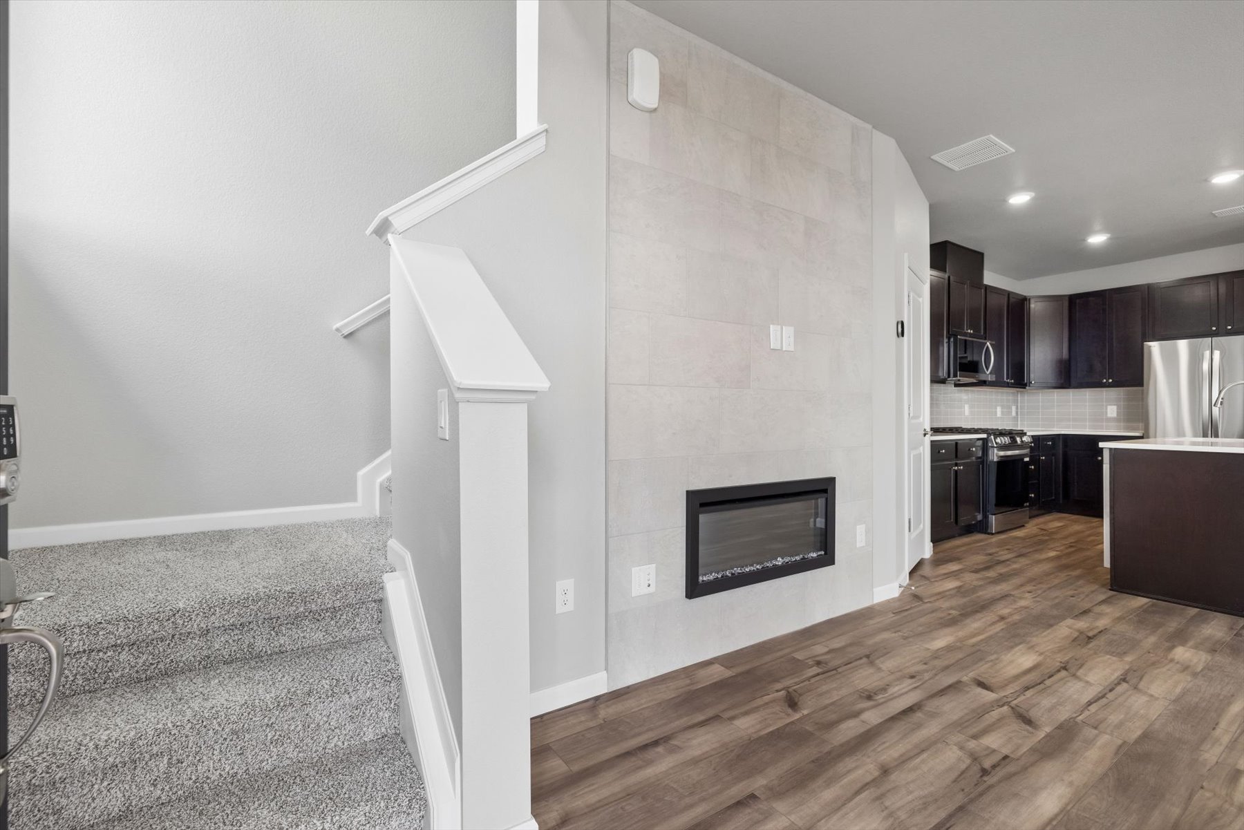 A kitchen with a wood floor.