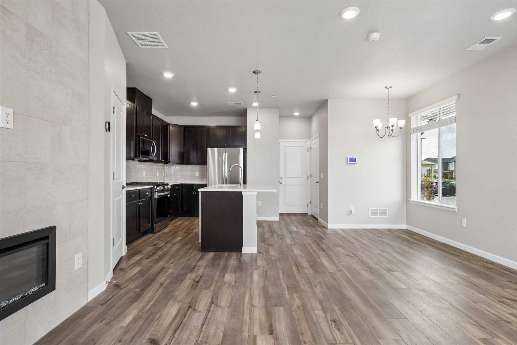 A kitchen with wooden floors.