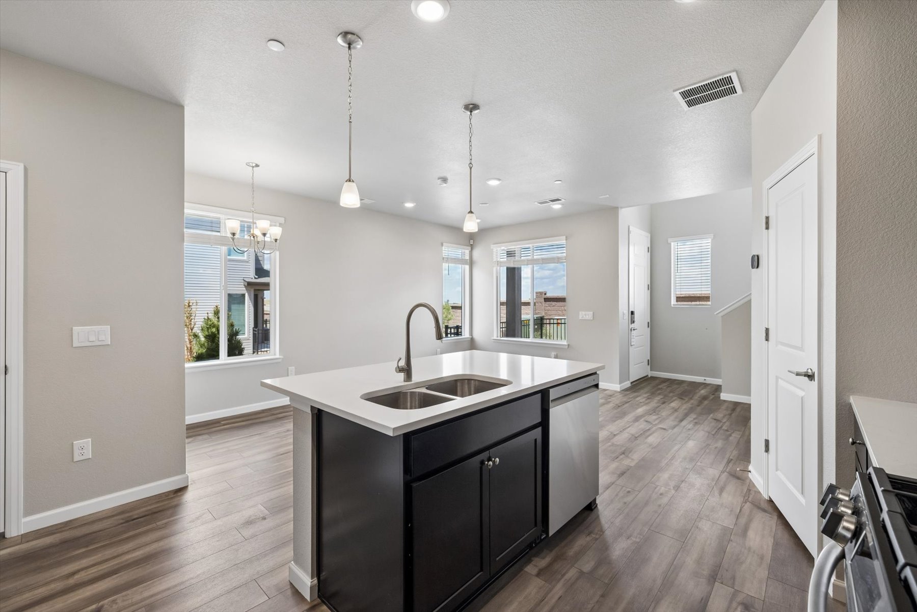 A kitchen with a black countertop.