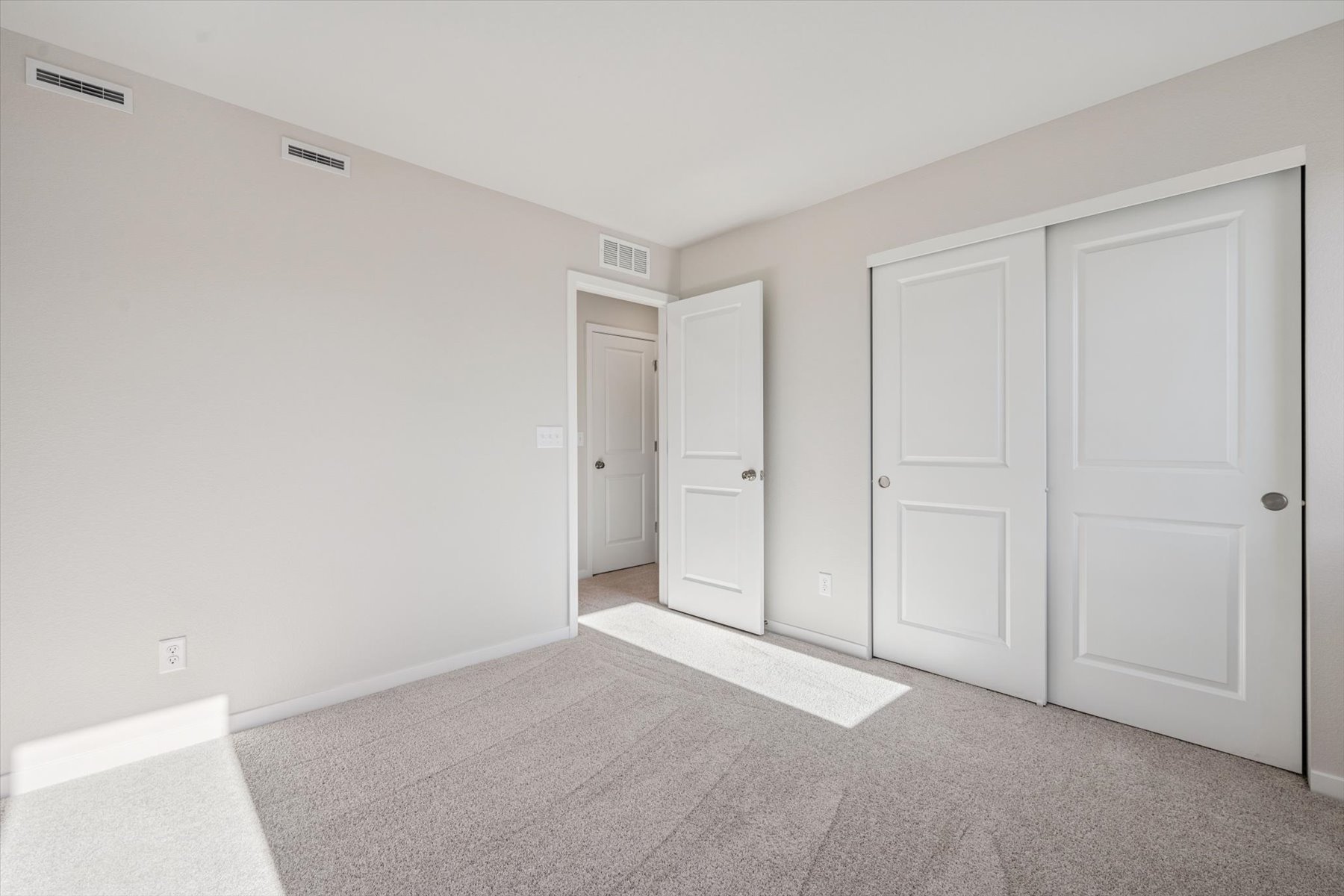 A room with white doors.