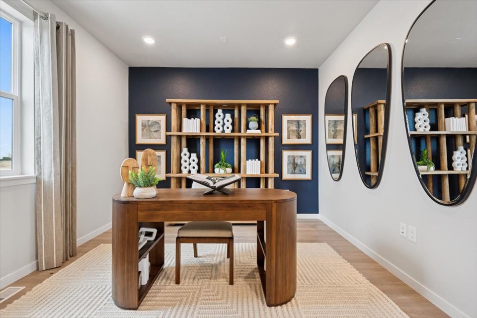 A room with a table and shelves.