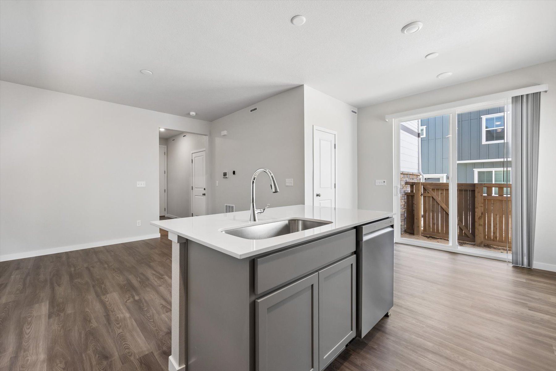 A kitchen with a sink and cabinets.