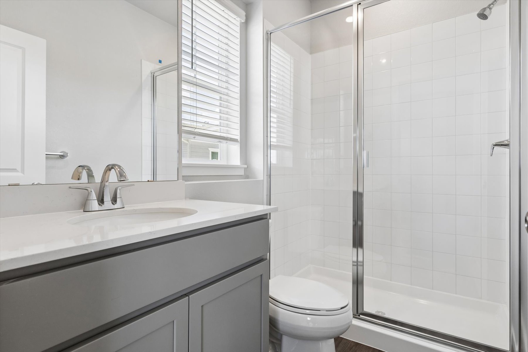 A bathroom with a glass shower.