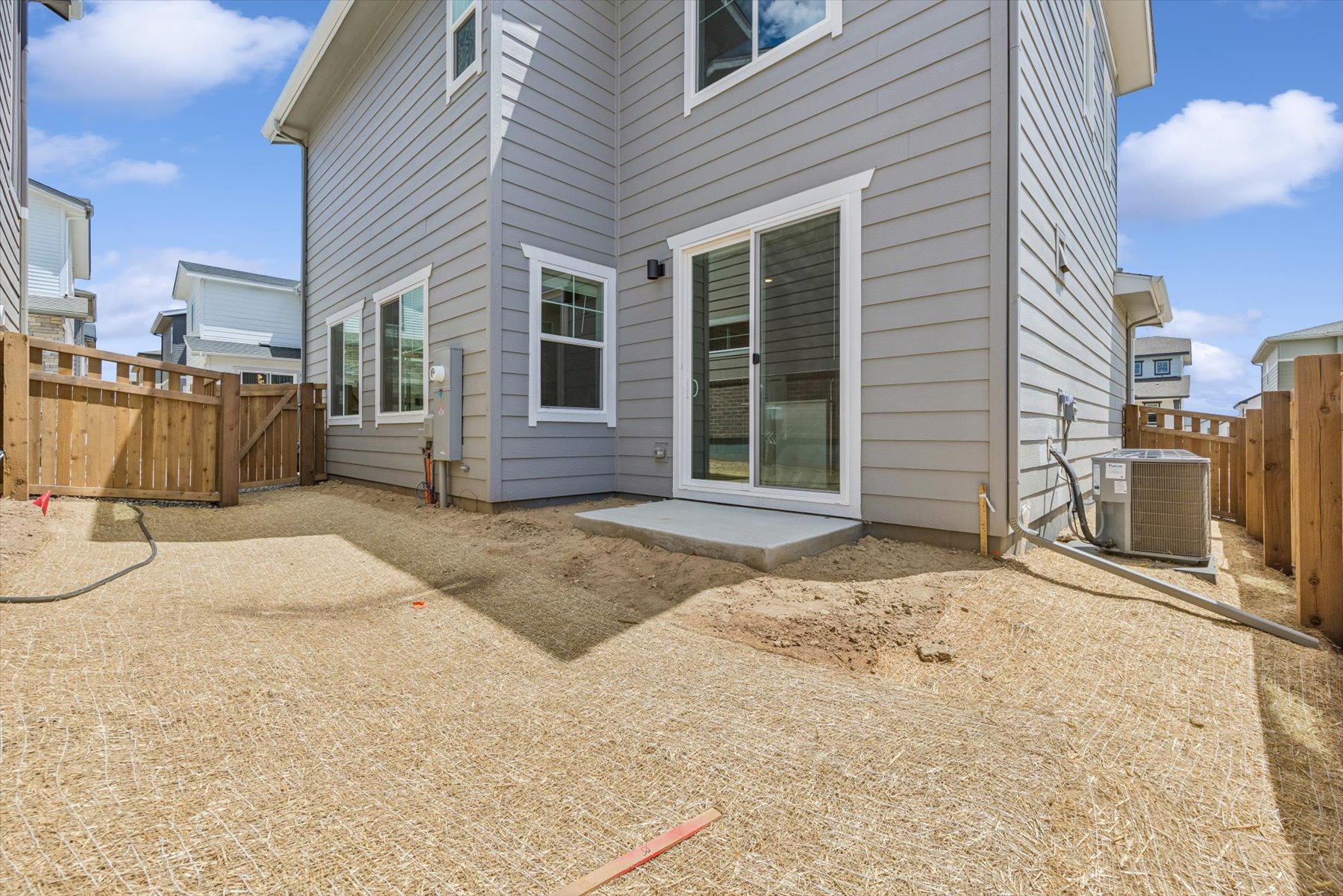 A house with a dirt yard.
