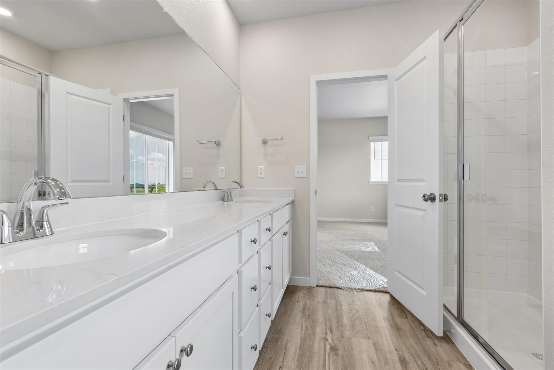 A bathroom with a glass shower.