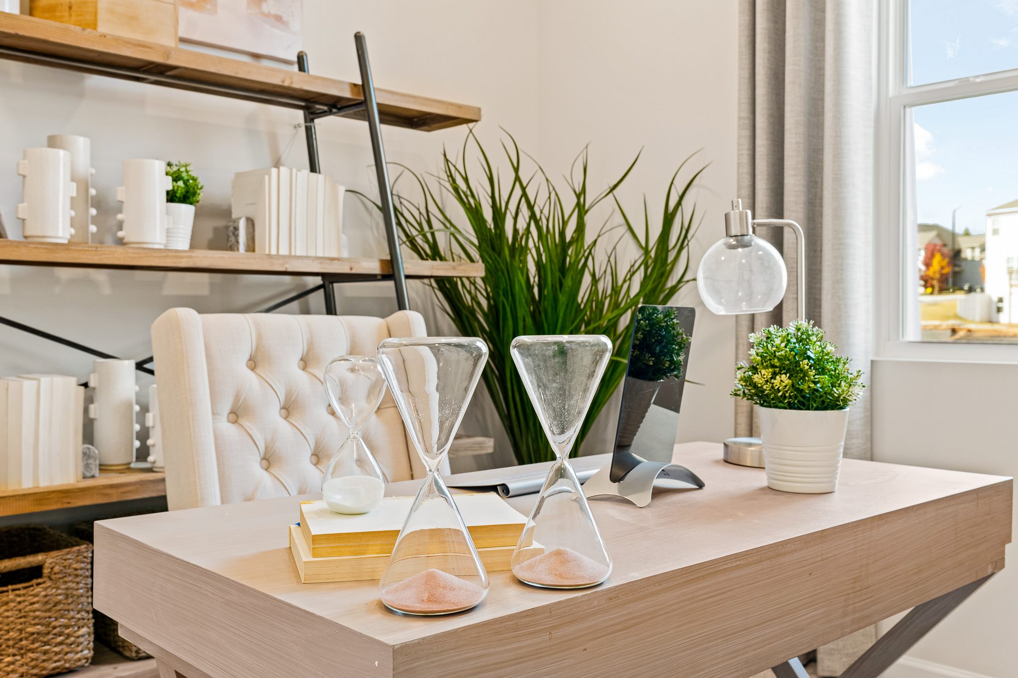 A table with a vase and chairs.