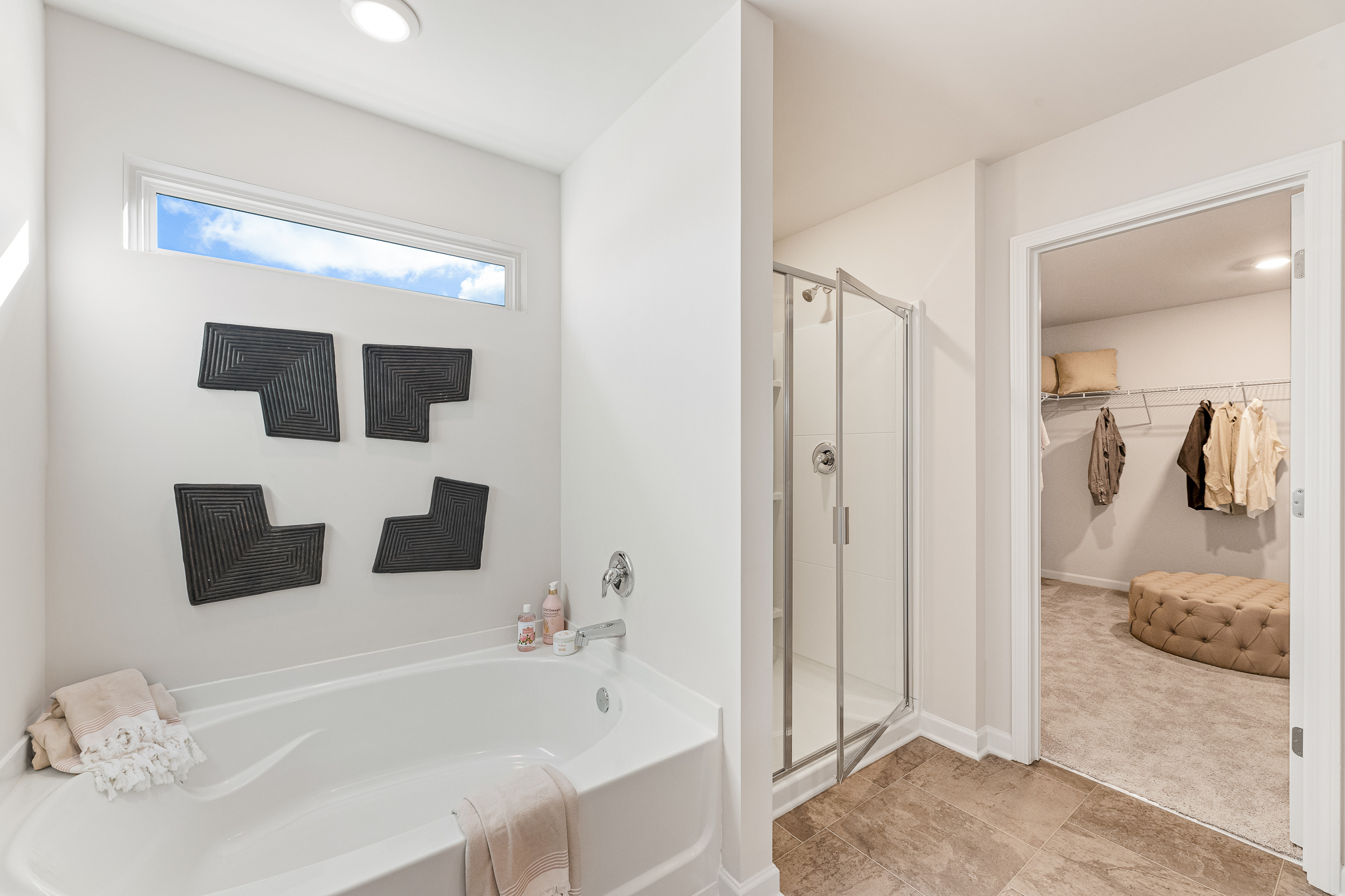 A bathroom with a tub and shower.