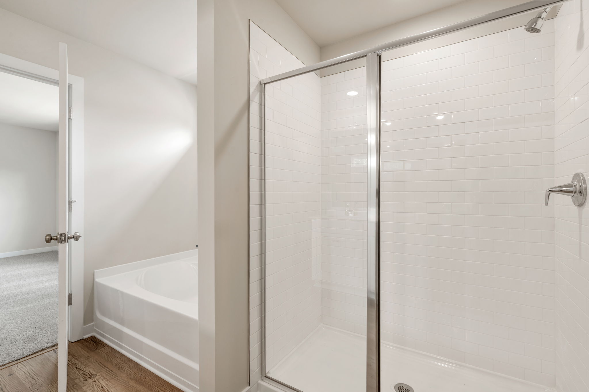 A bathroom with a glass shower.