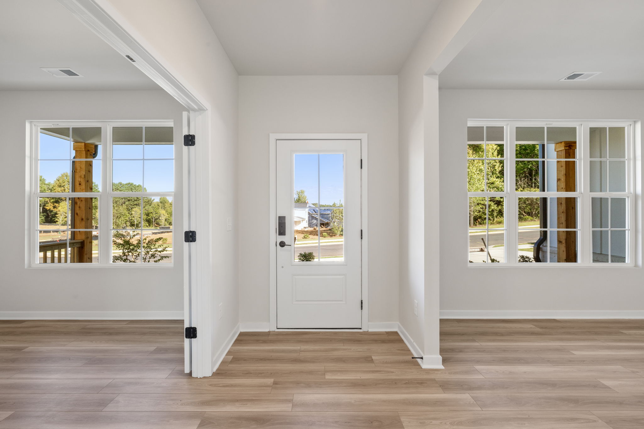 A room with white walls and windows.