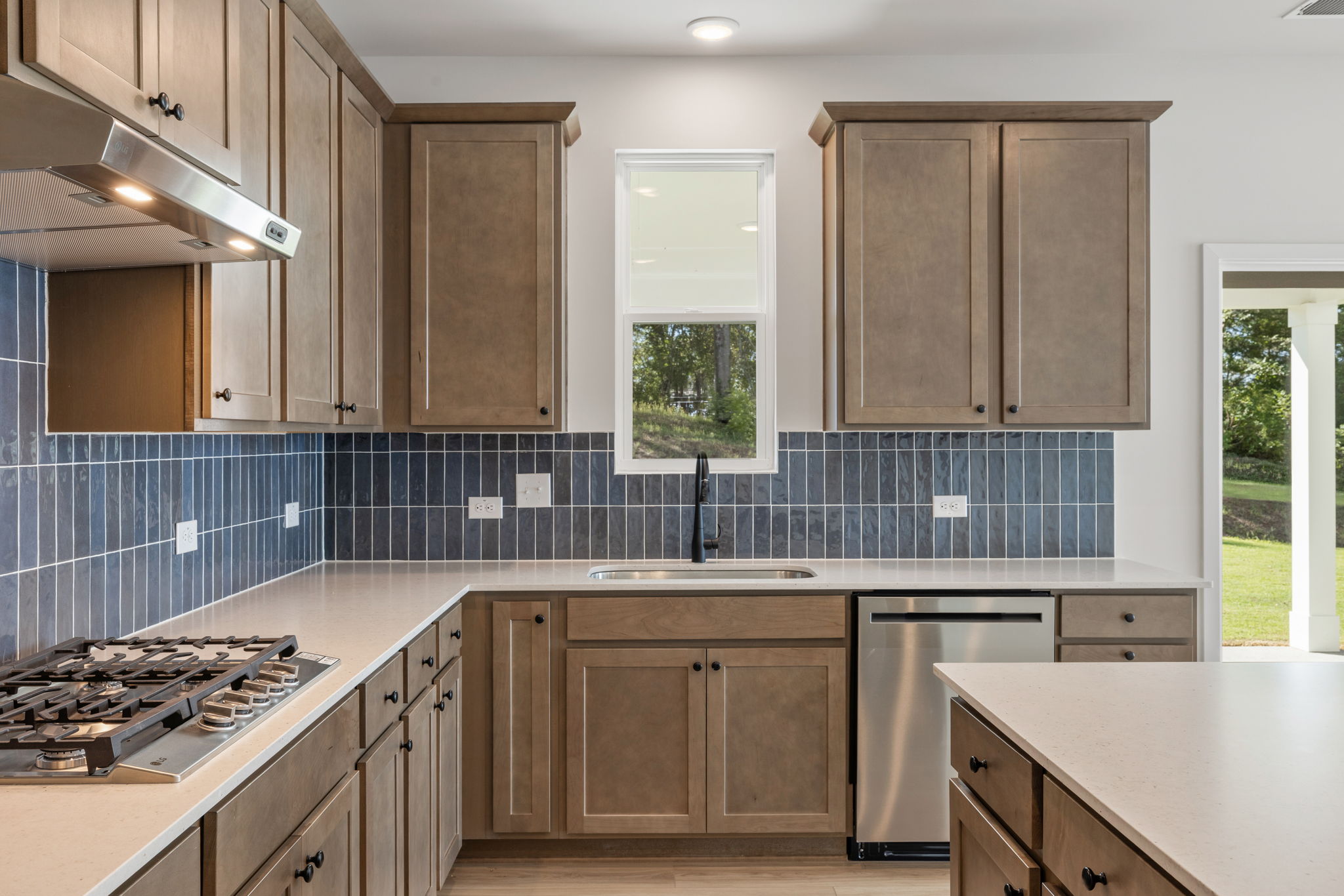 A kitchen with wooden cabinets.