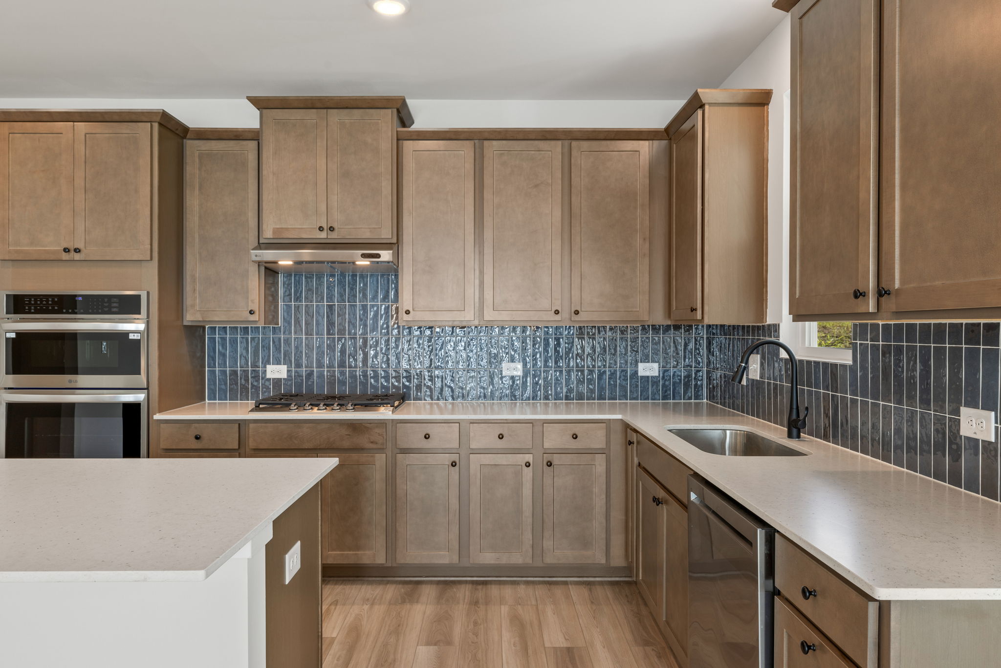 A kitchen with wooden cabinets.