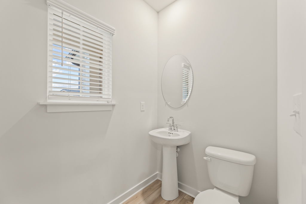 A bathroom with a sink and a mirror.