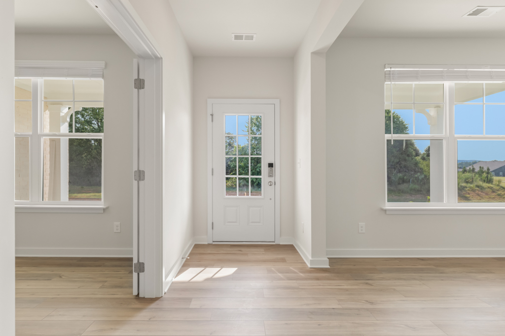 A room with white walls and windows.