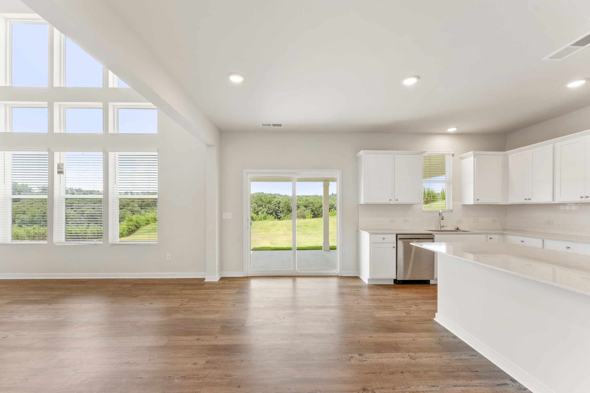 A large kitchen with white cabinets.