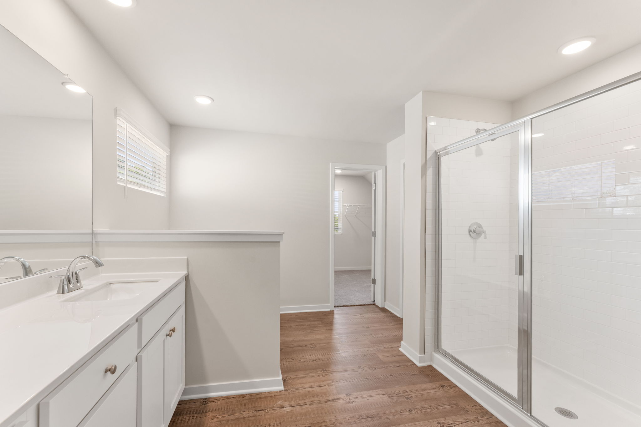 A bathroom with a glass shower.