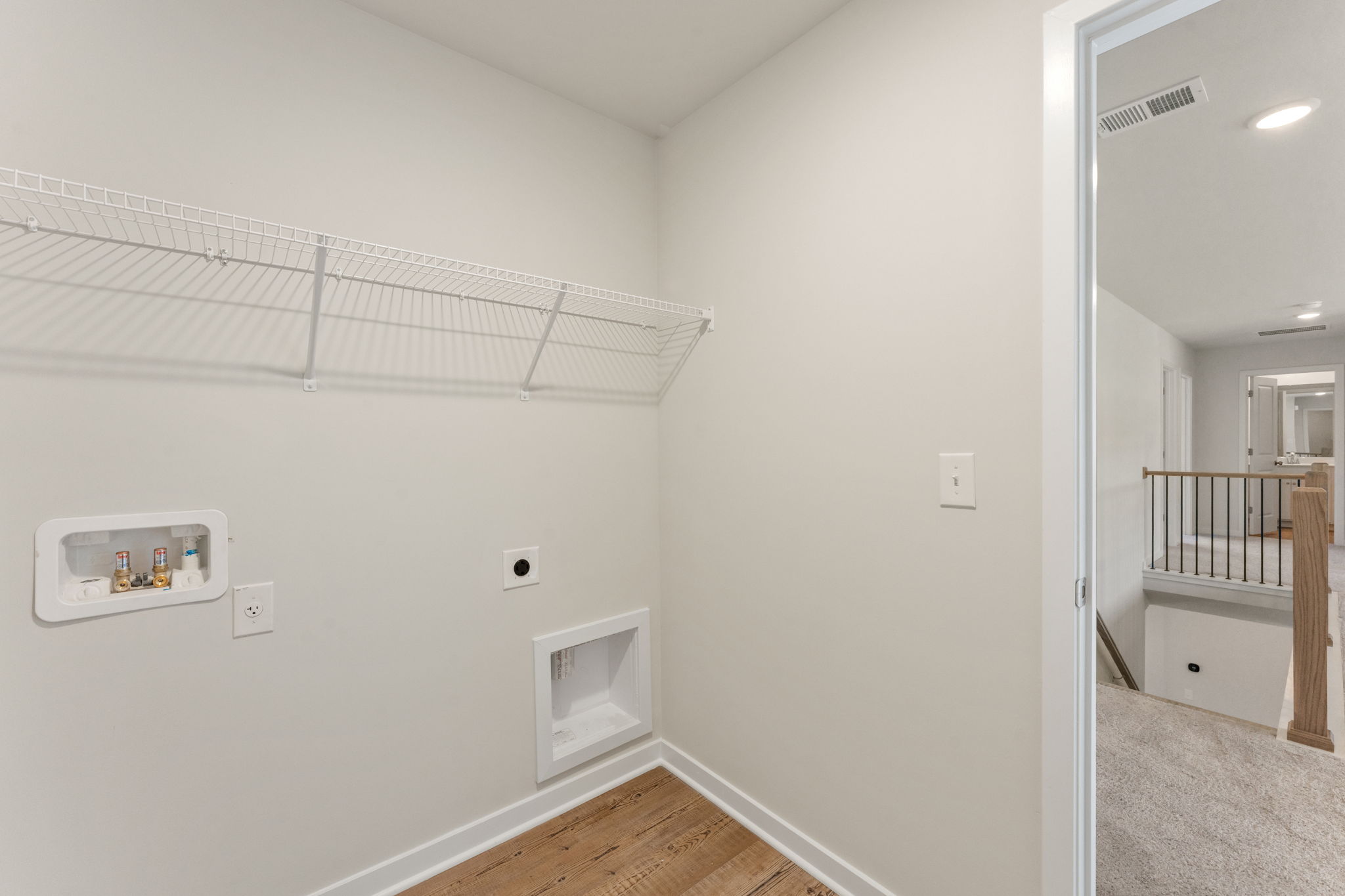 A room with a shower and a toilet.