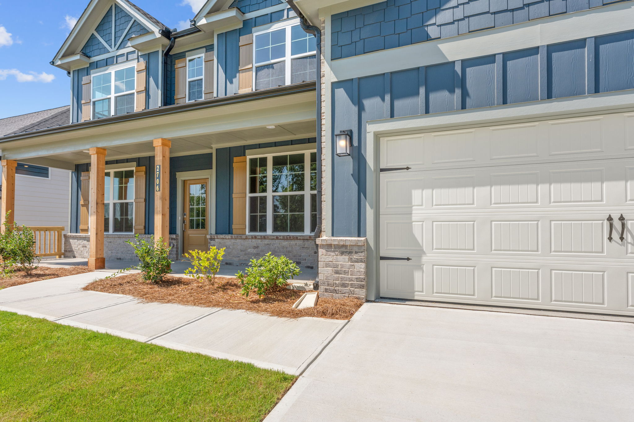 A building with a front yard.