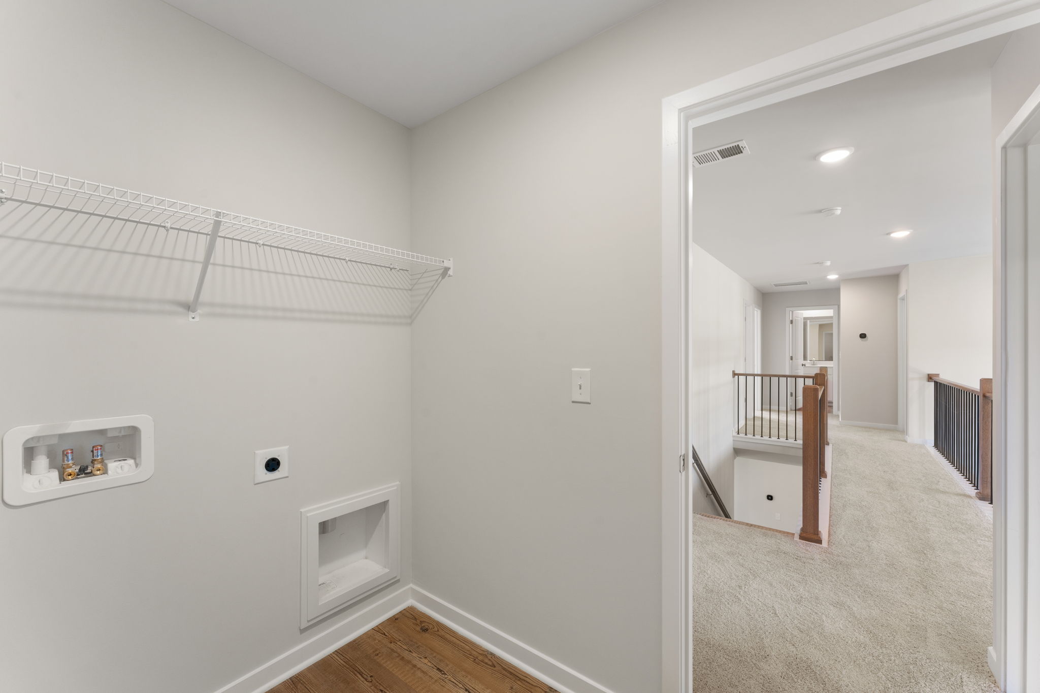 A room with a bed and a door.
