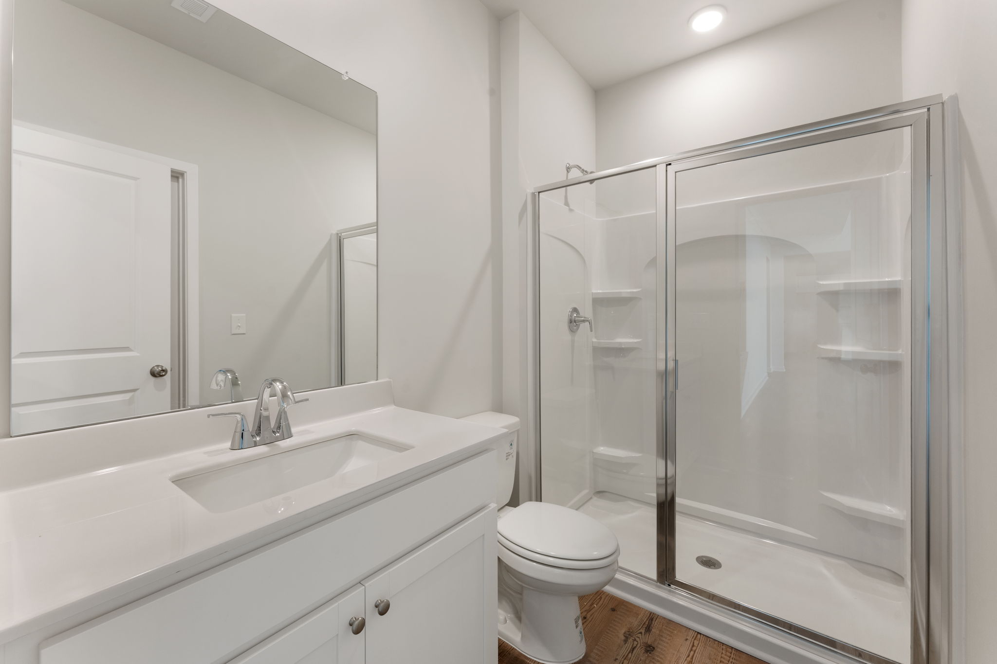 A bathroom with a glass shower.