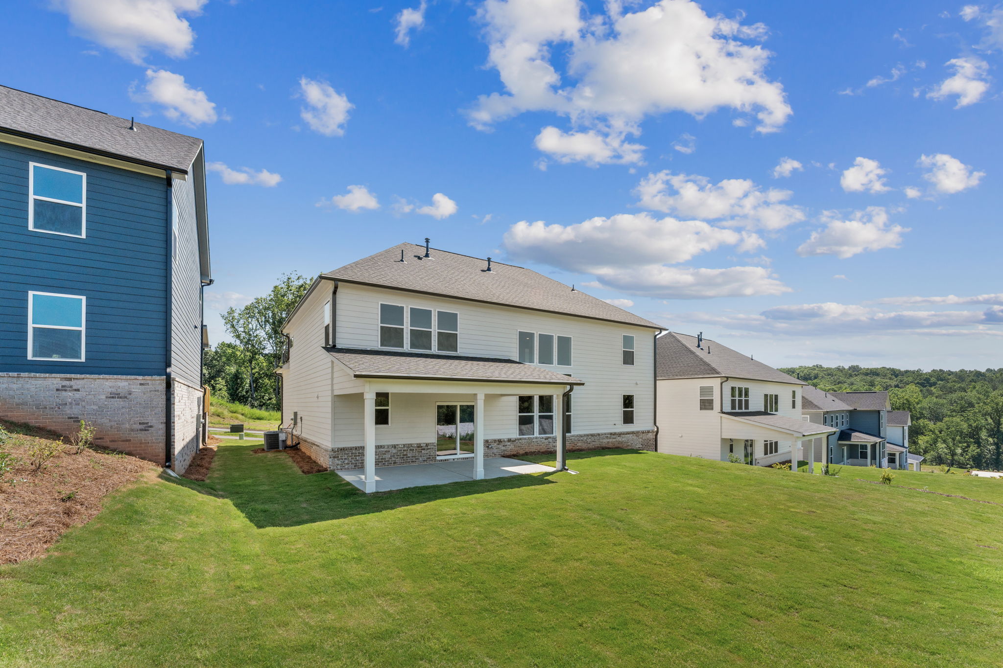 A house with a lawn in front of it.