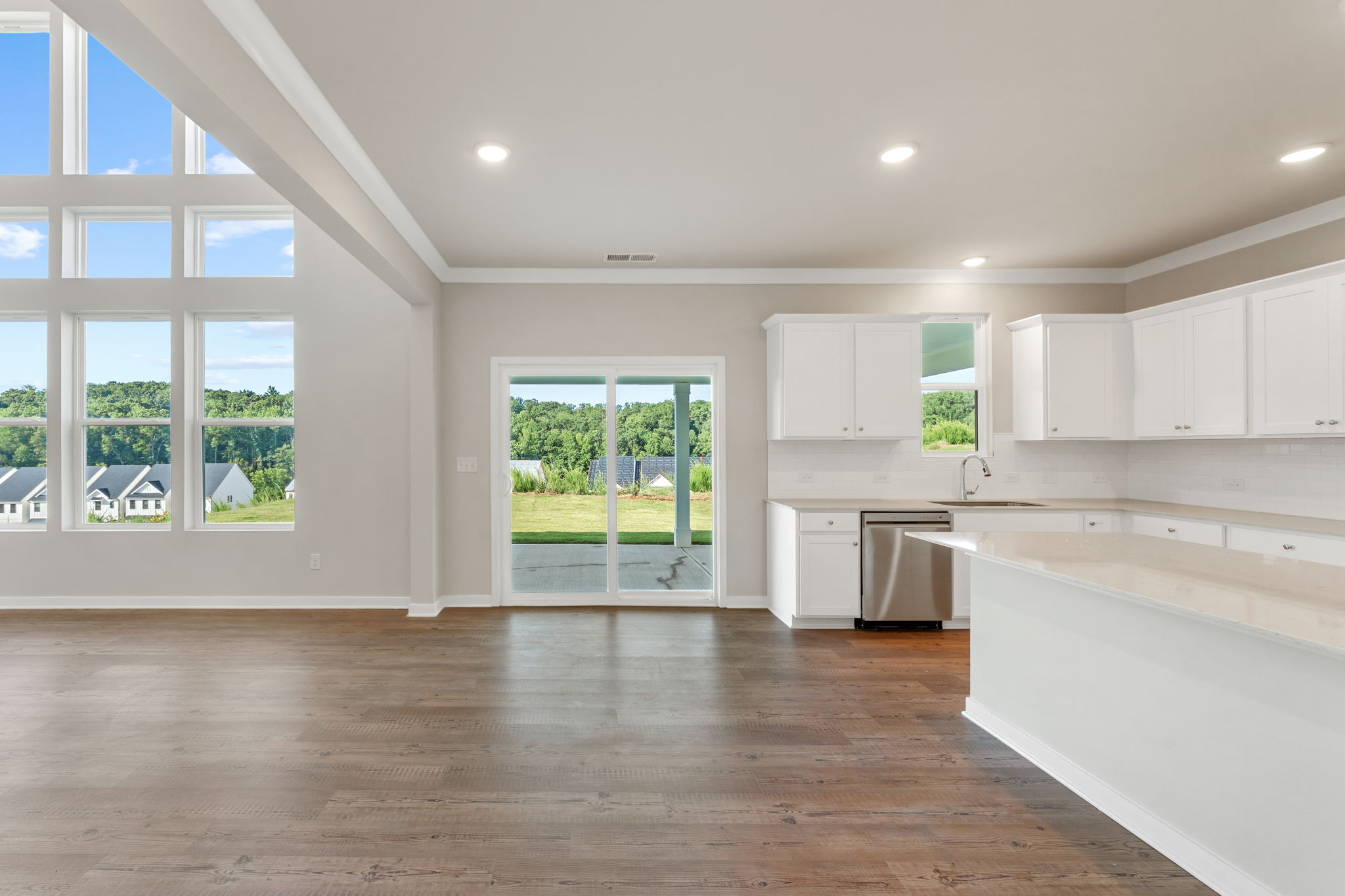 A large kitchen with white cabinets.