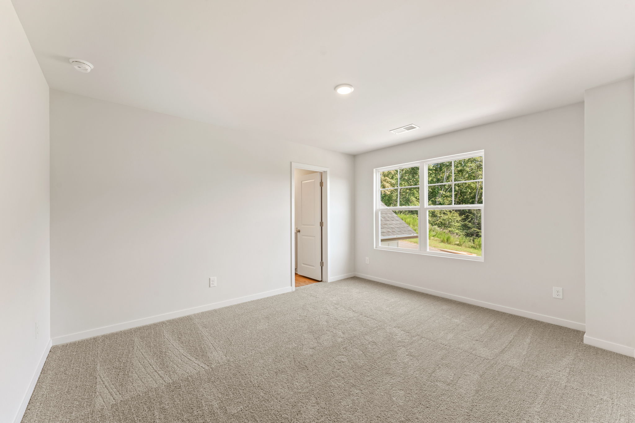 A room with a door and a window.