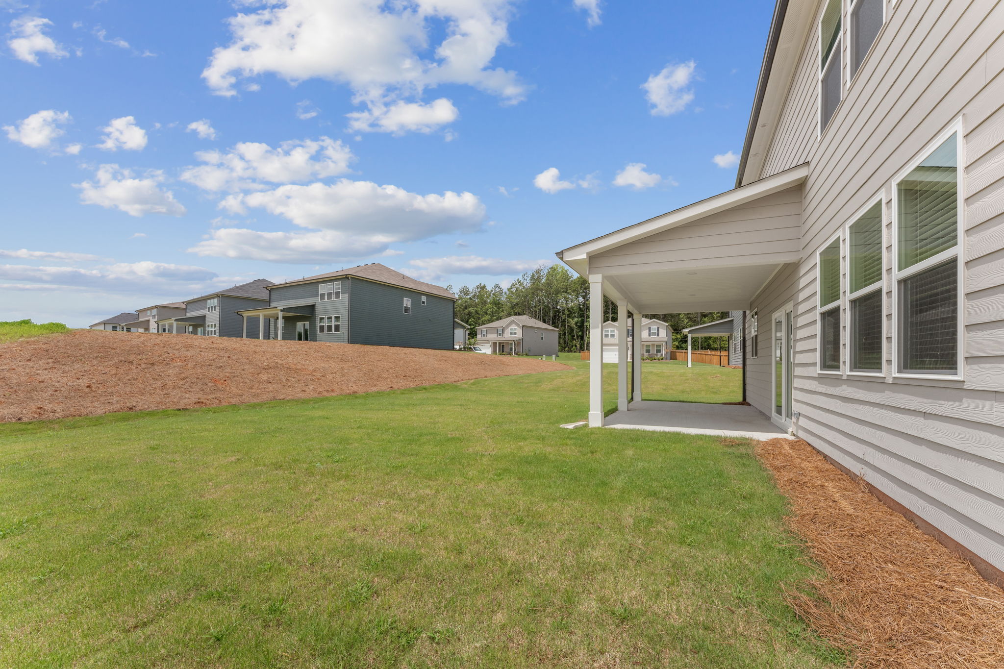 A green lawn between buildings.