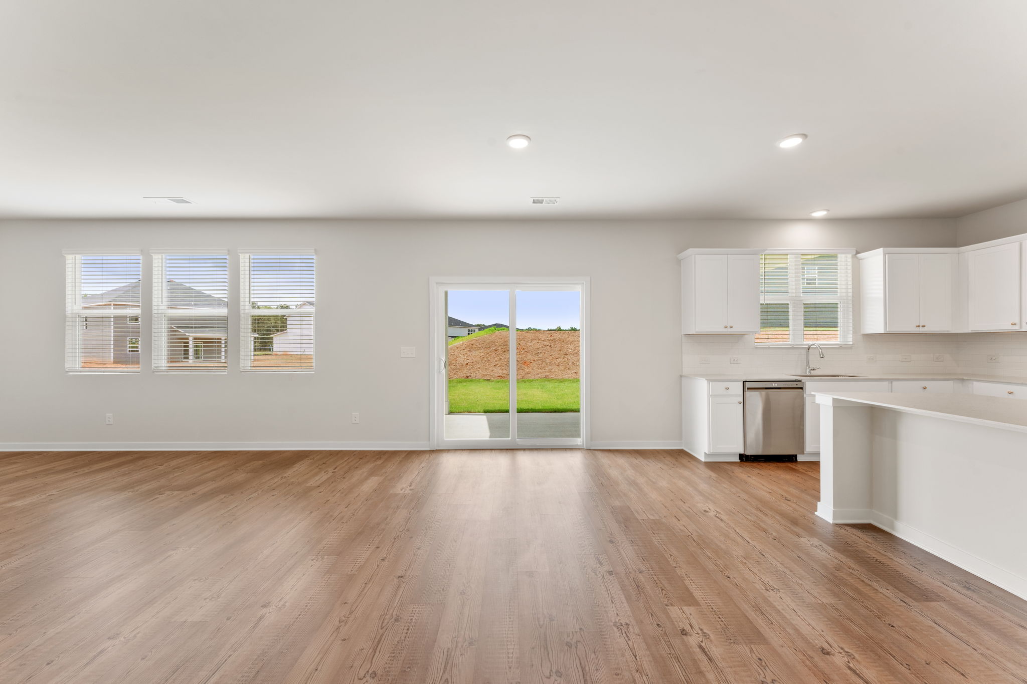 A large kitchen with white cabinets.