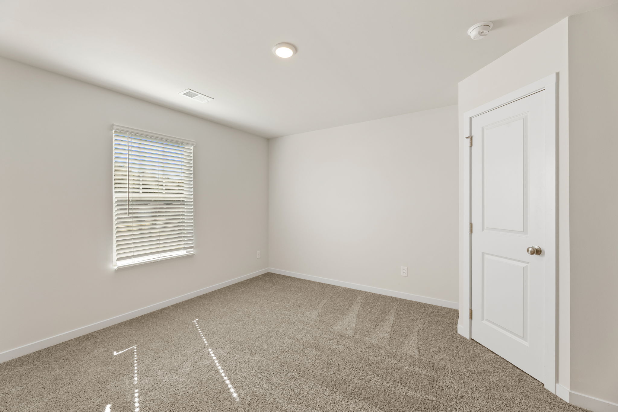 A room with a door and a window.