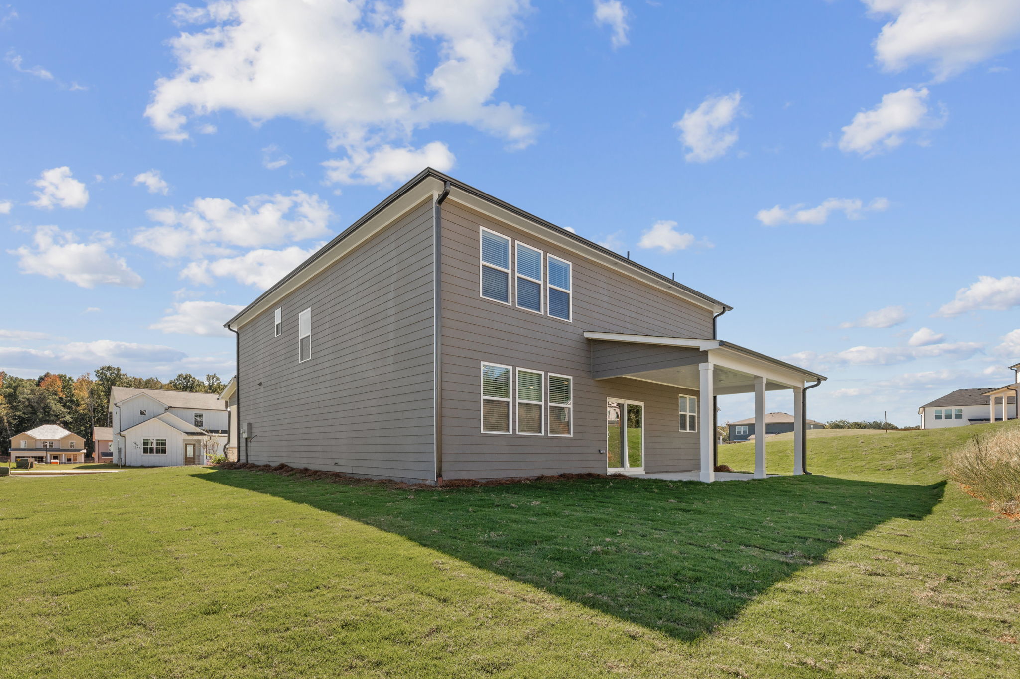 A house with a grass yard.