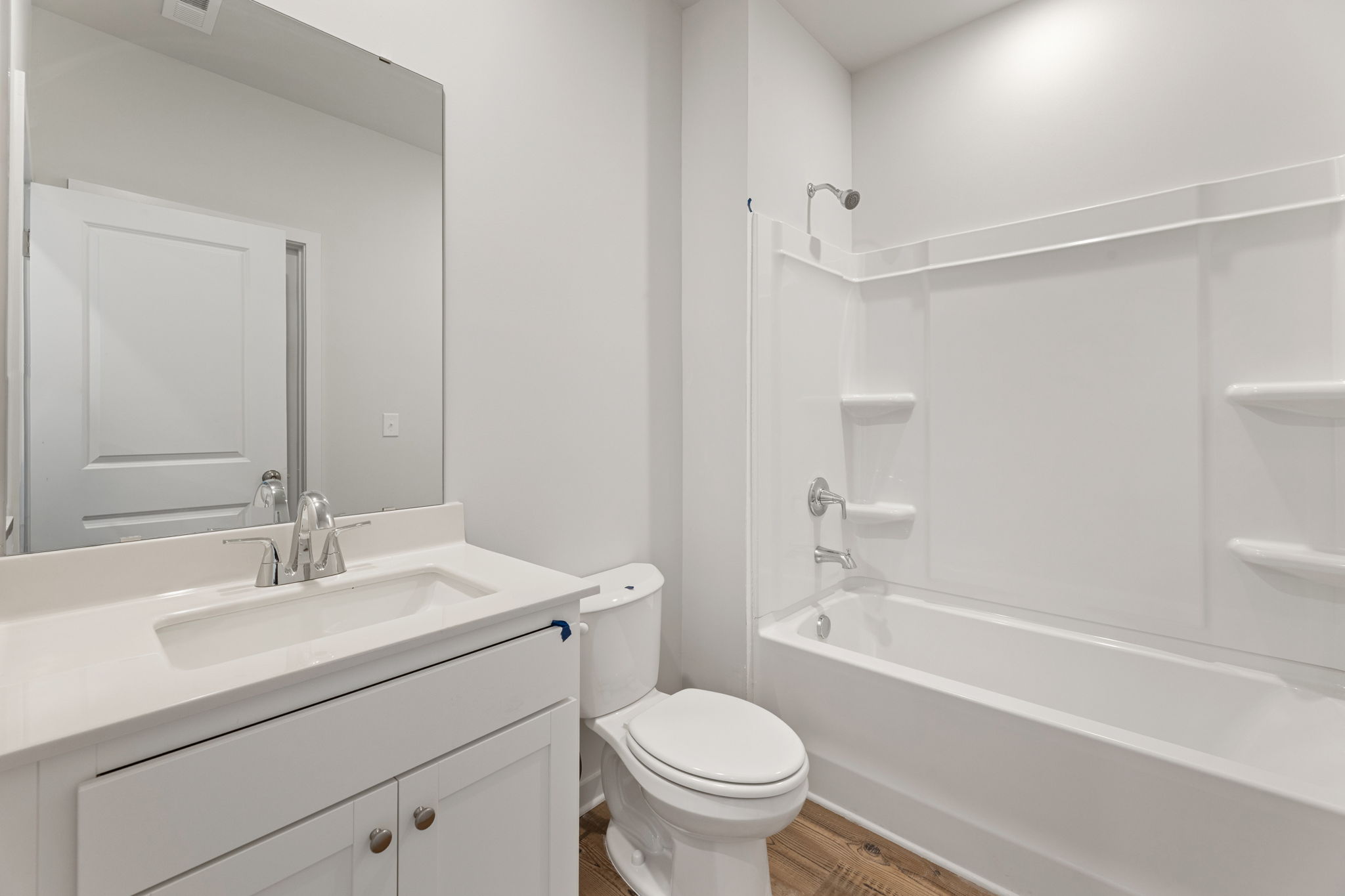 A bathroom with a toilet and sink.