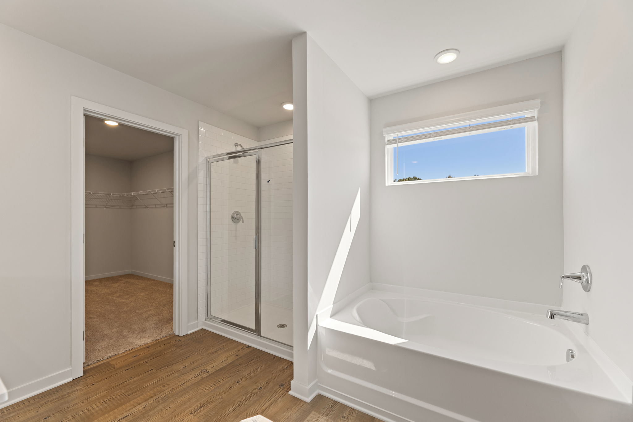 A bathroom with a tub and shower.