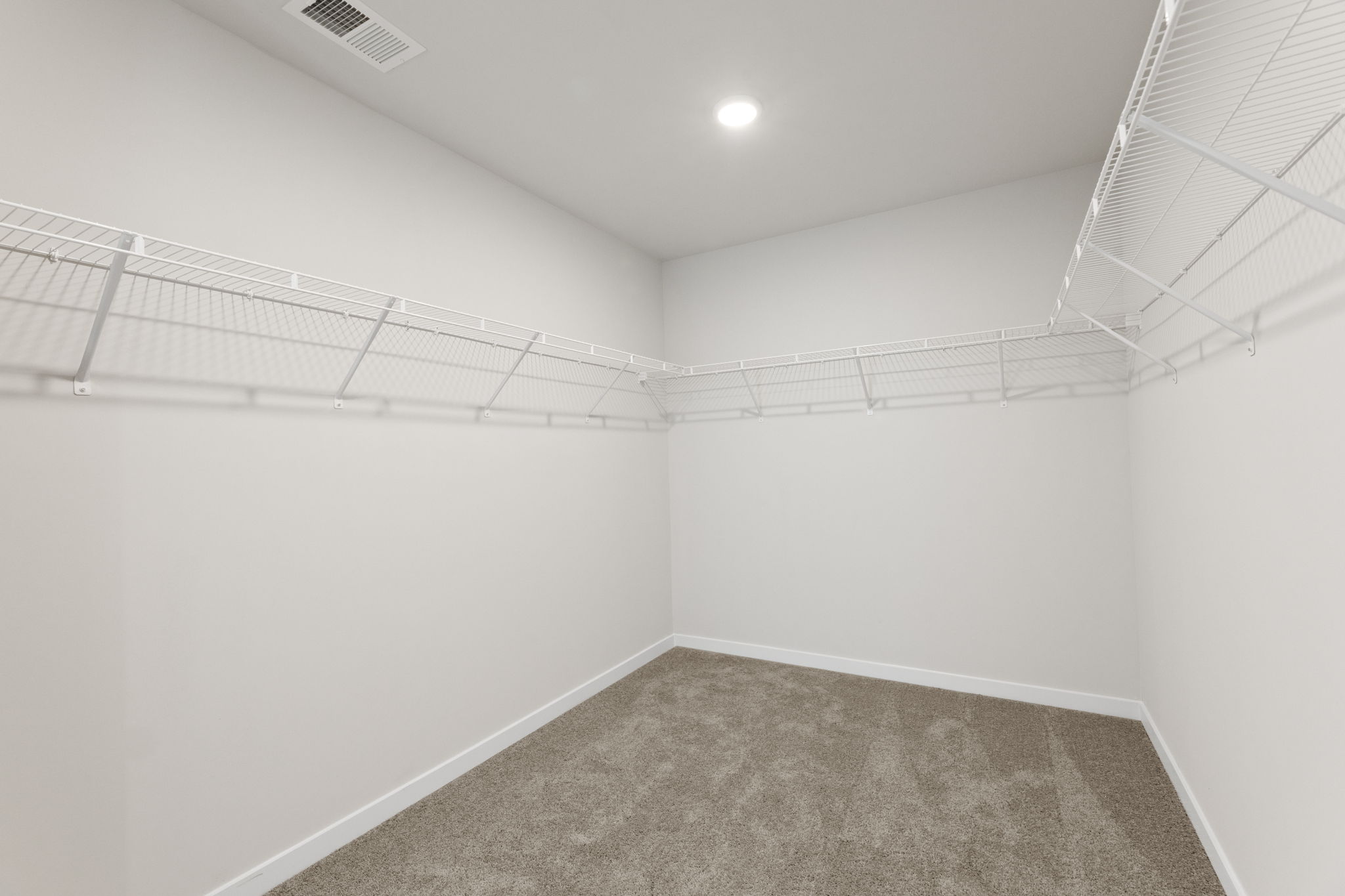 A hallway with white walls.