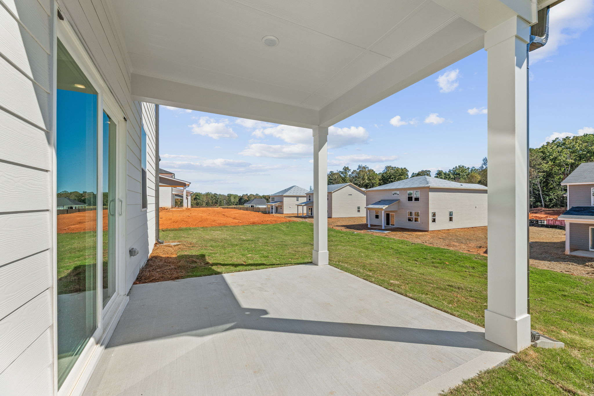 A view of a backyard from a porch.