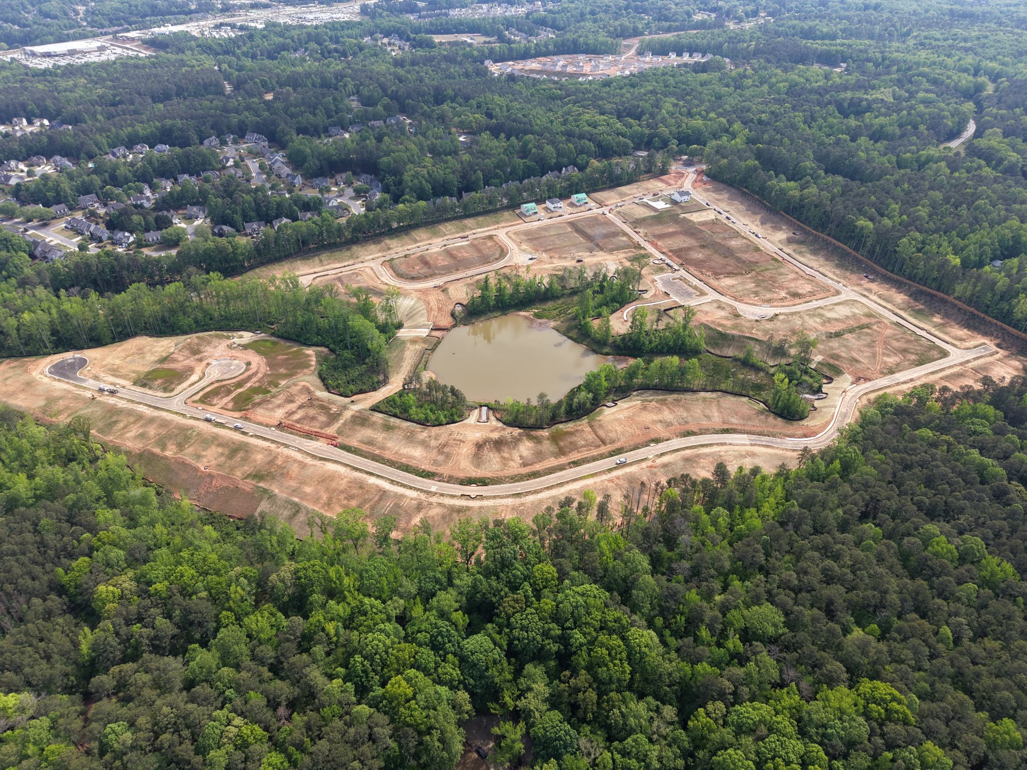 A large dam surrounded by trees.