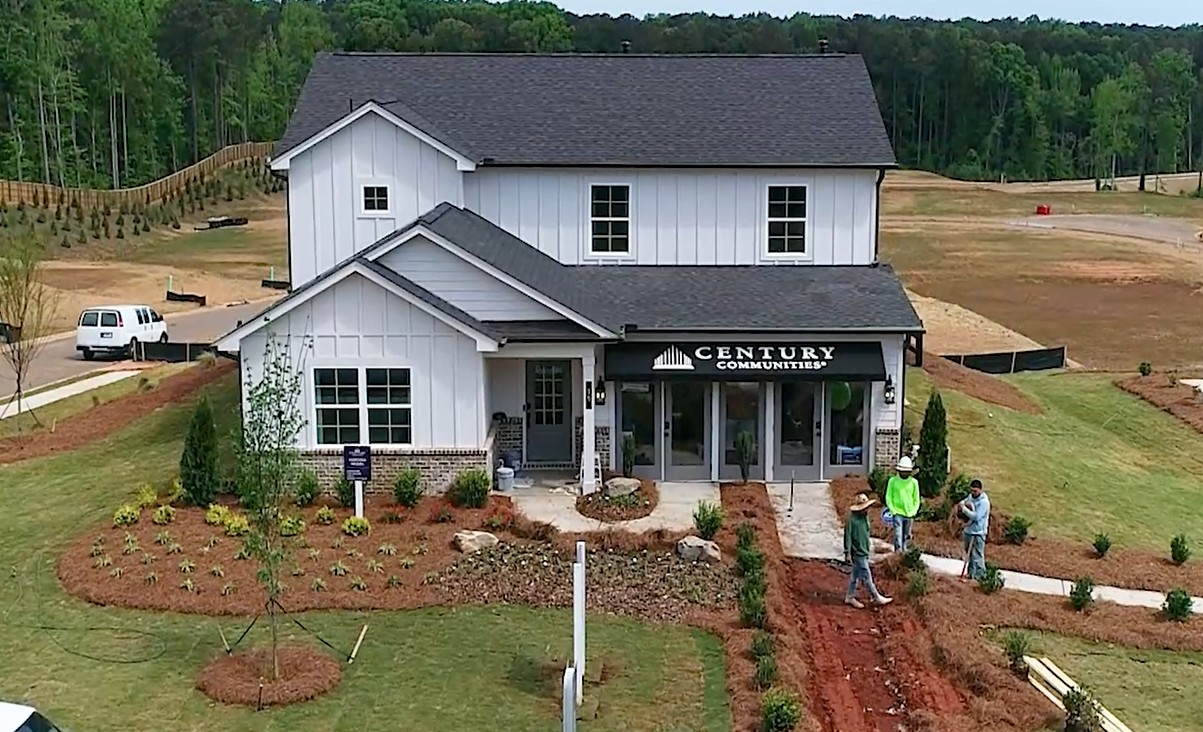 A house with a sign on the front.