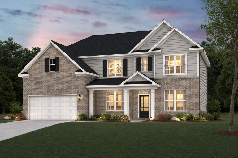 A house with a large front yard.