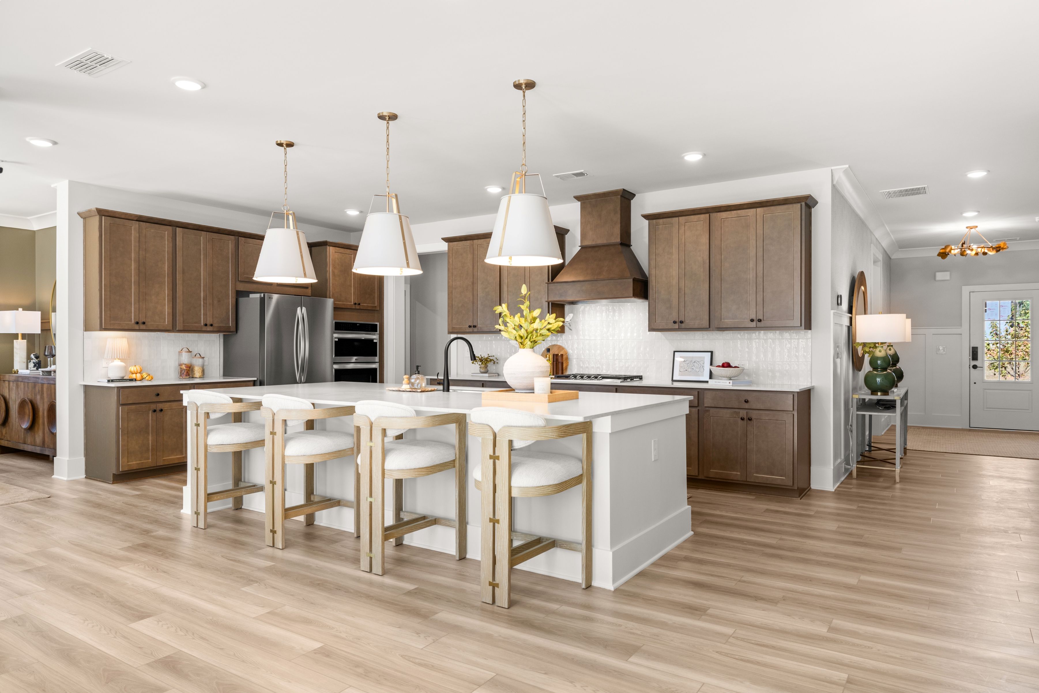 A kitchen with a wood floor.