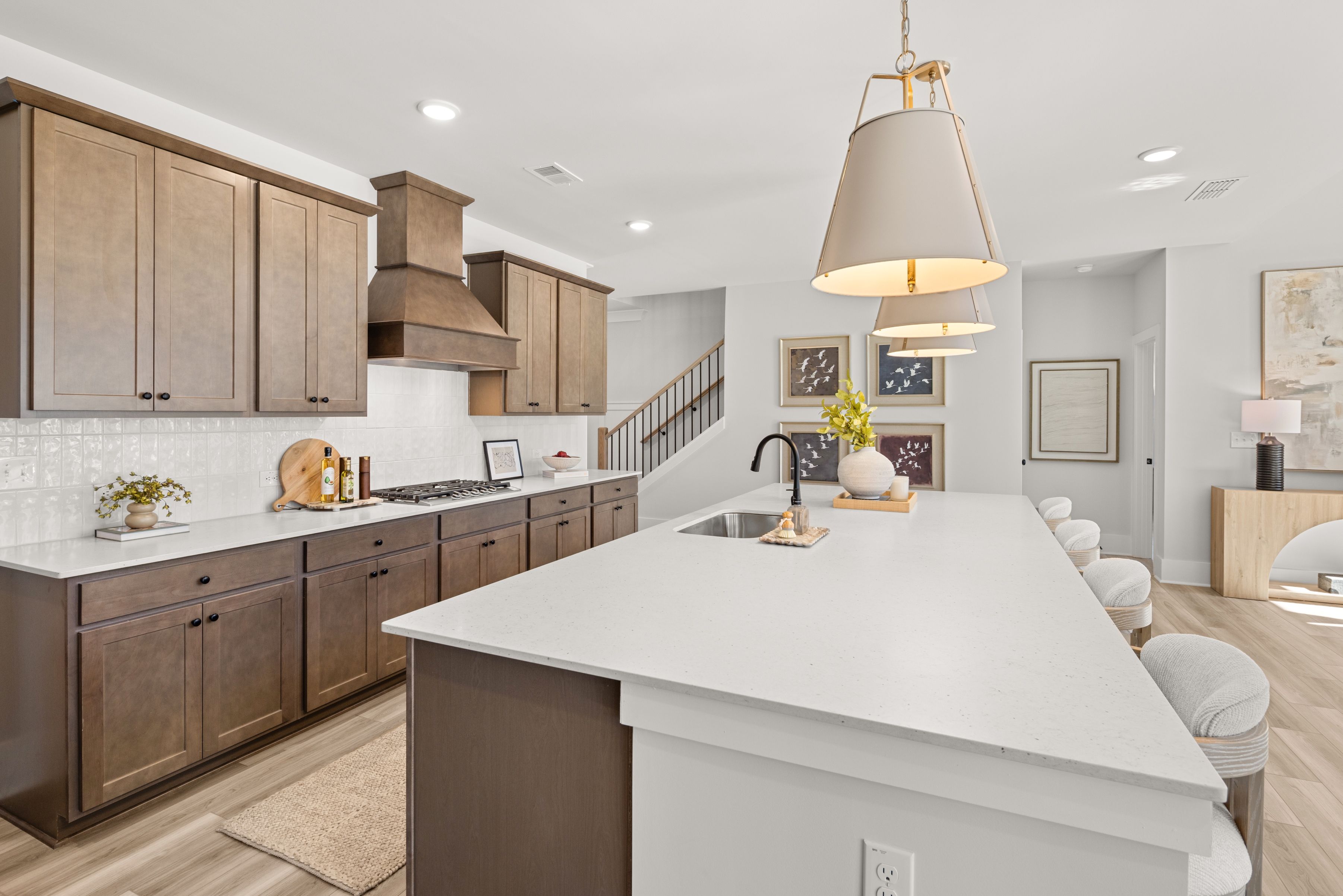 A kitchen with a marble island.