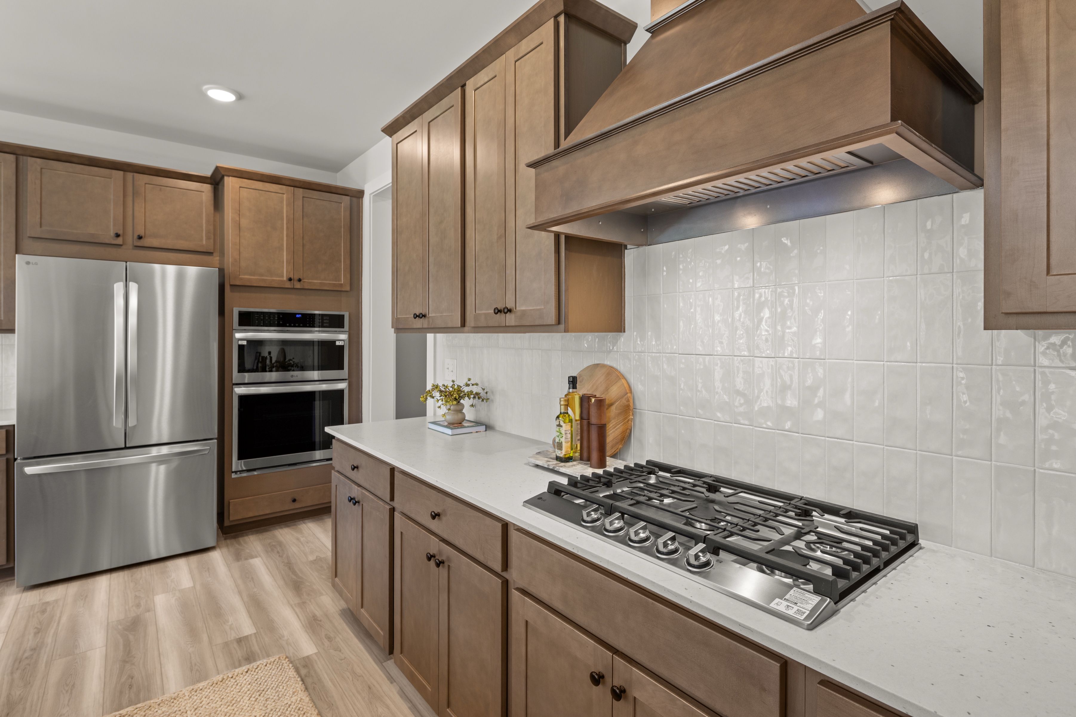 A kitchen with wooden cabinets.