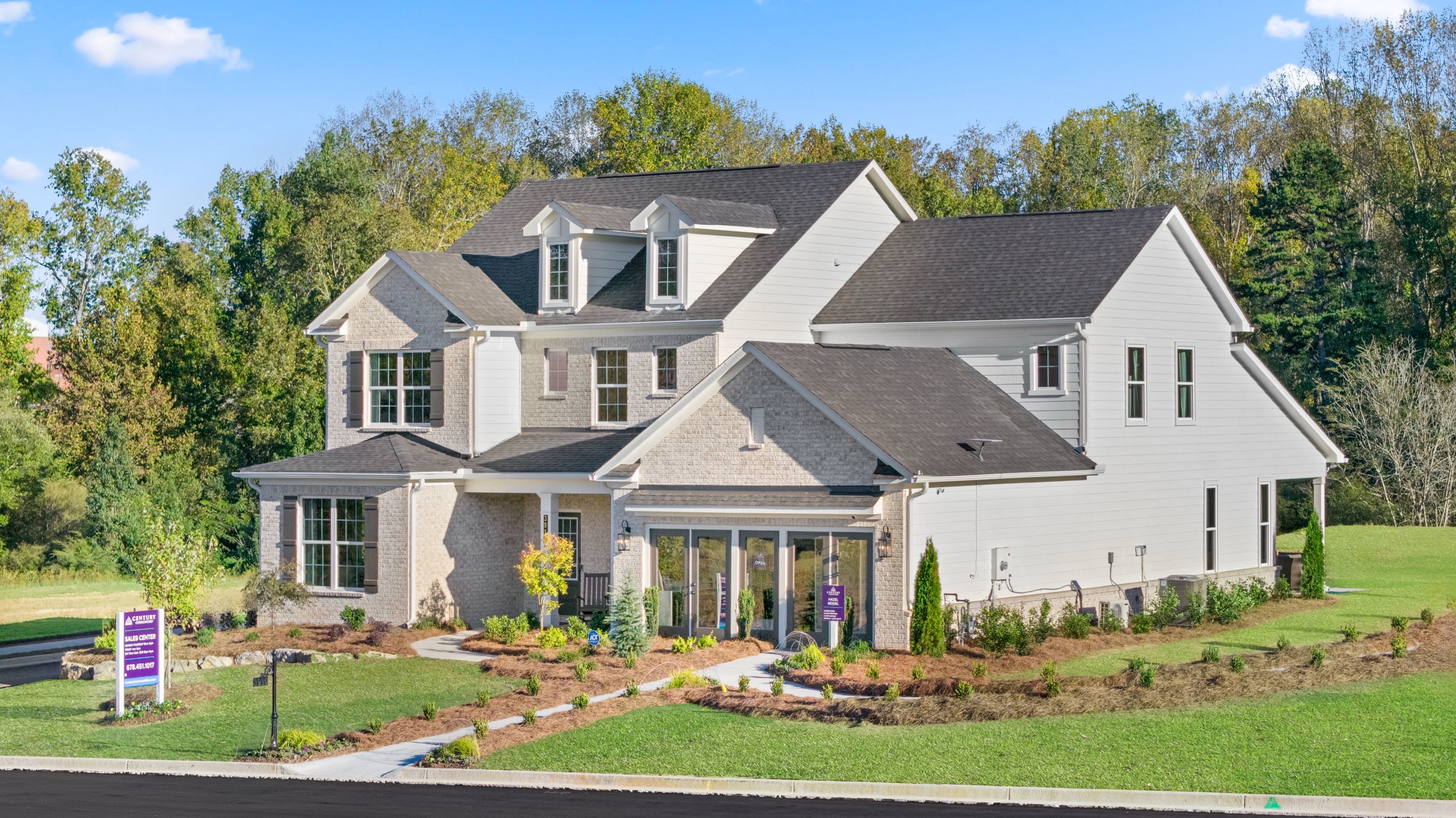 A large house with a lawn in front of it.