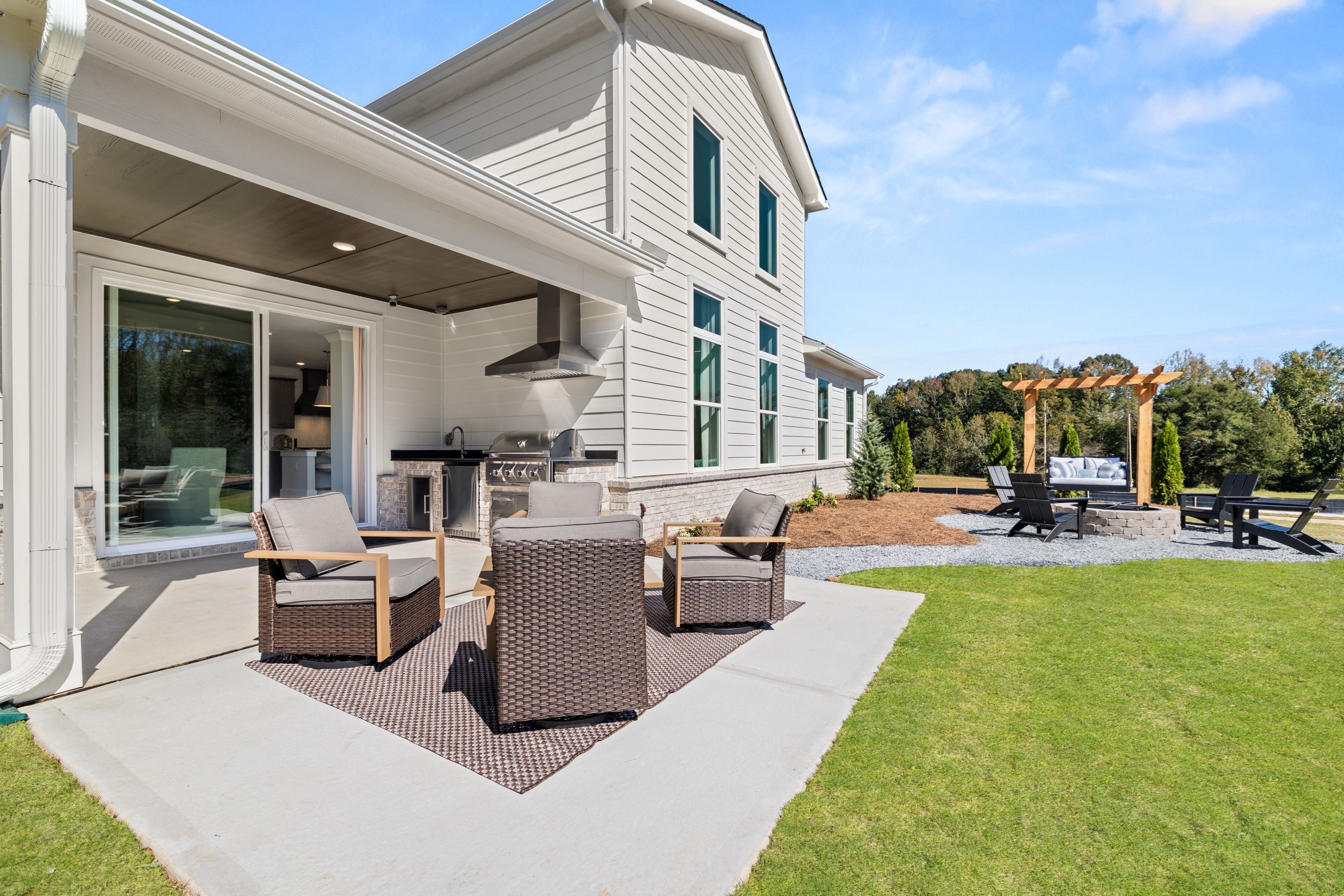 A house with a patio and chairs.