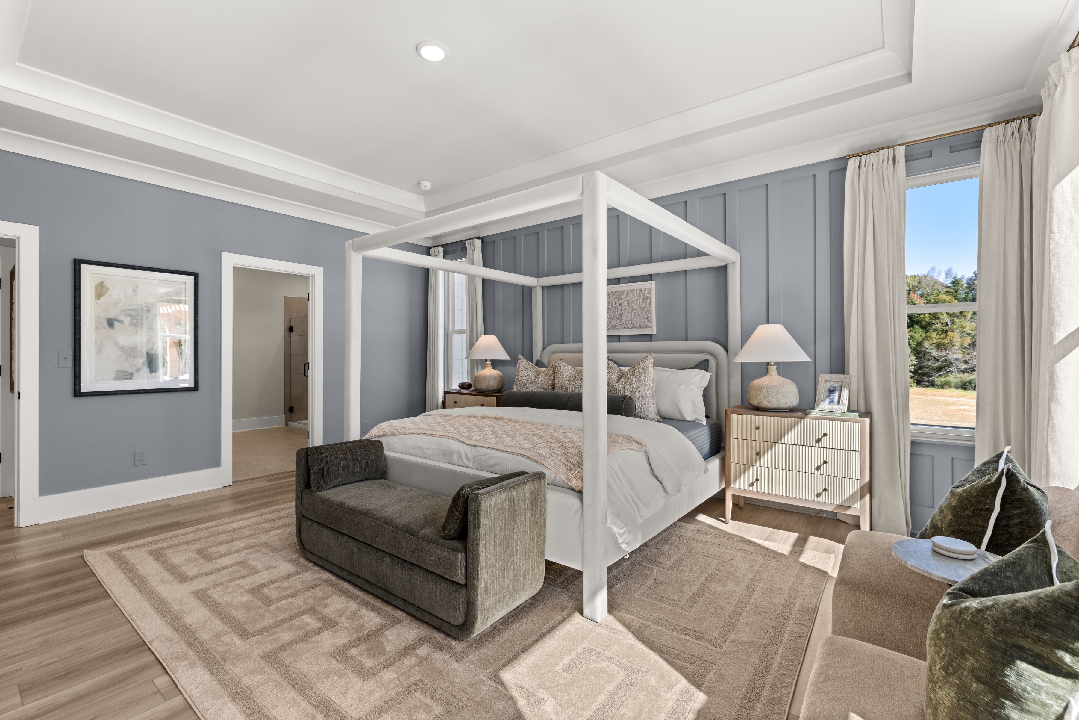 A bedroom with a bed and a couch.