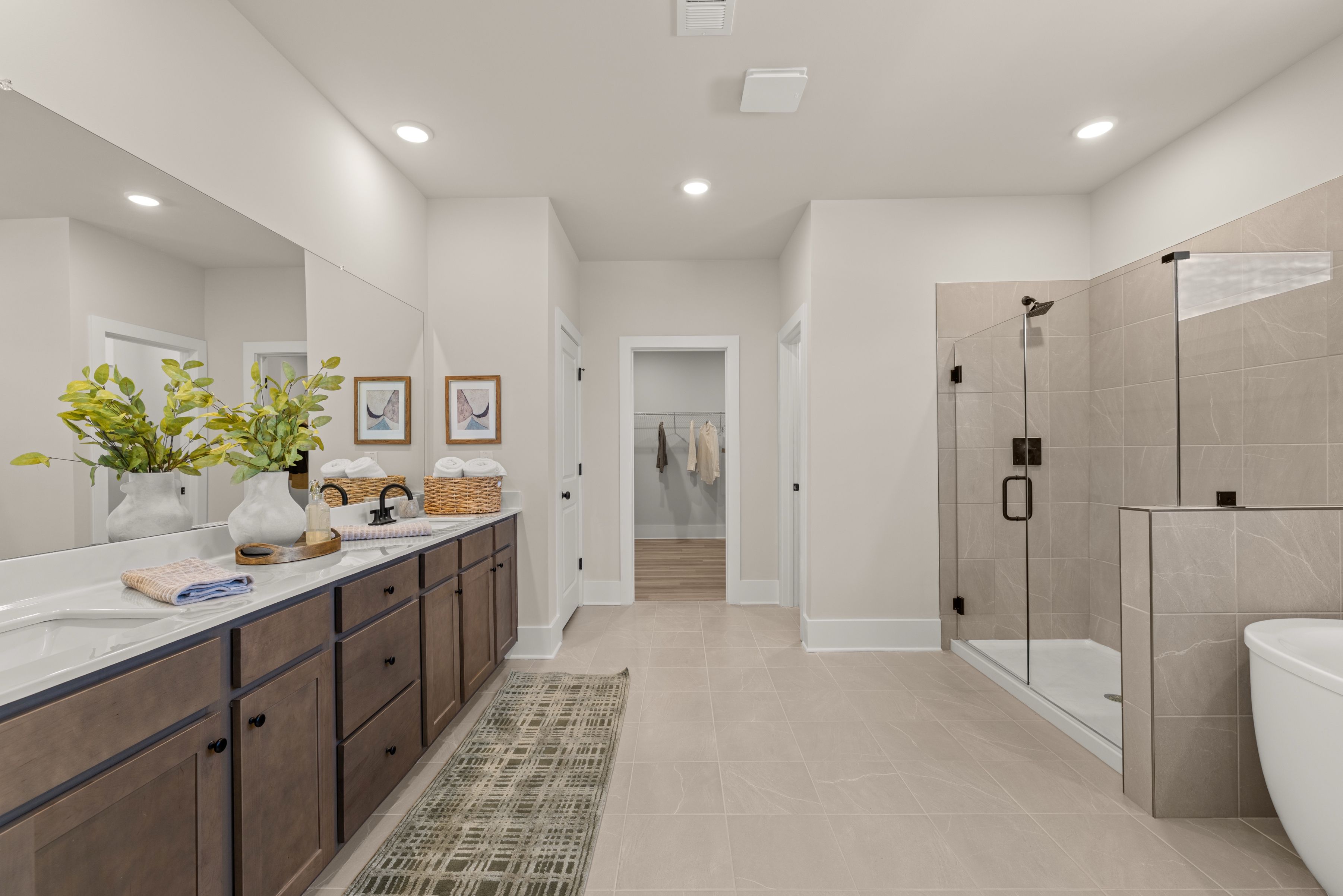 A bathroom with a shower and sink.