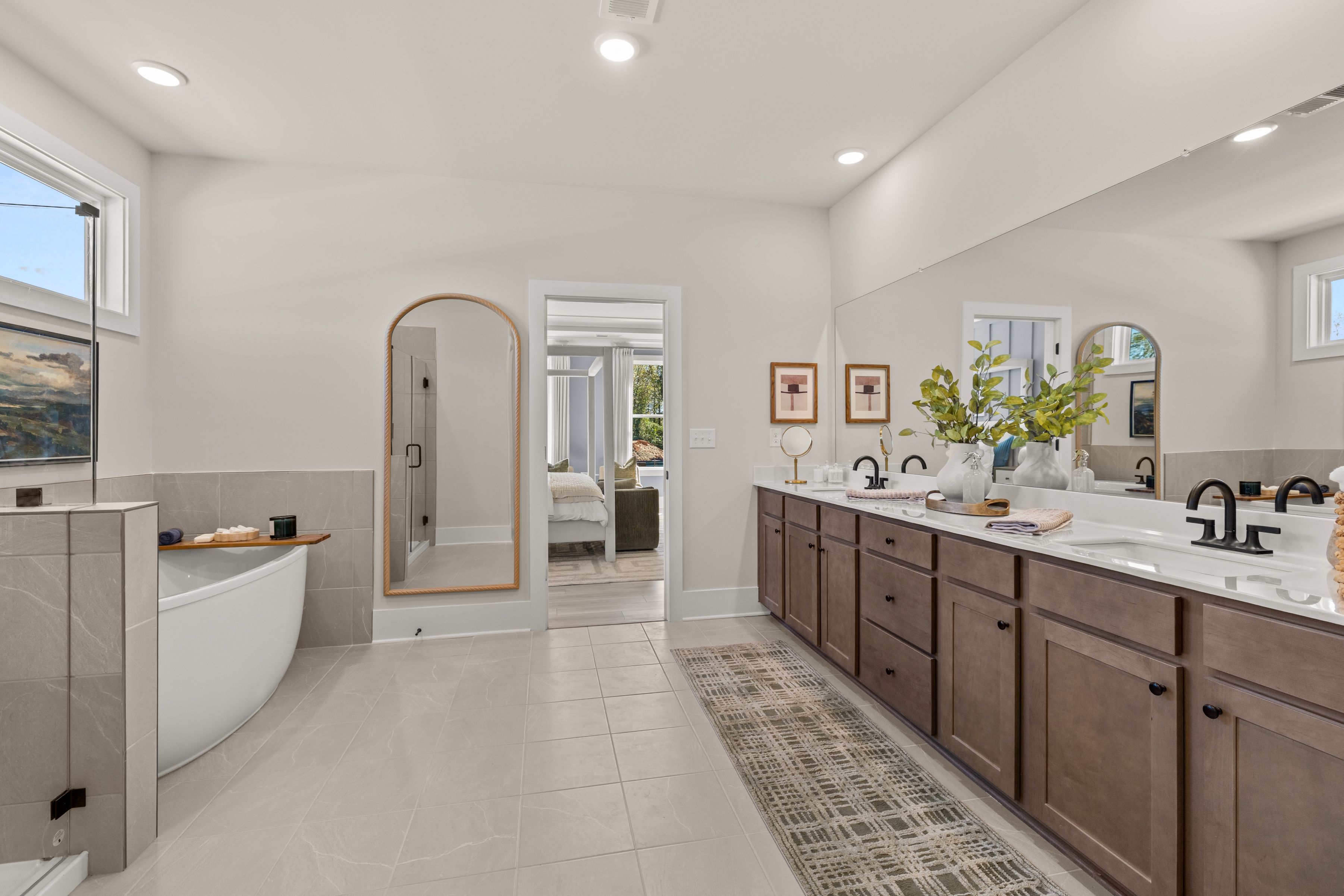 A large bathroom with marble counters.