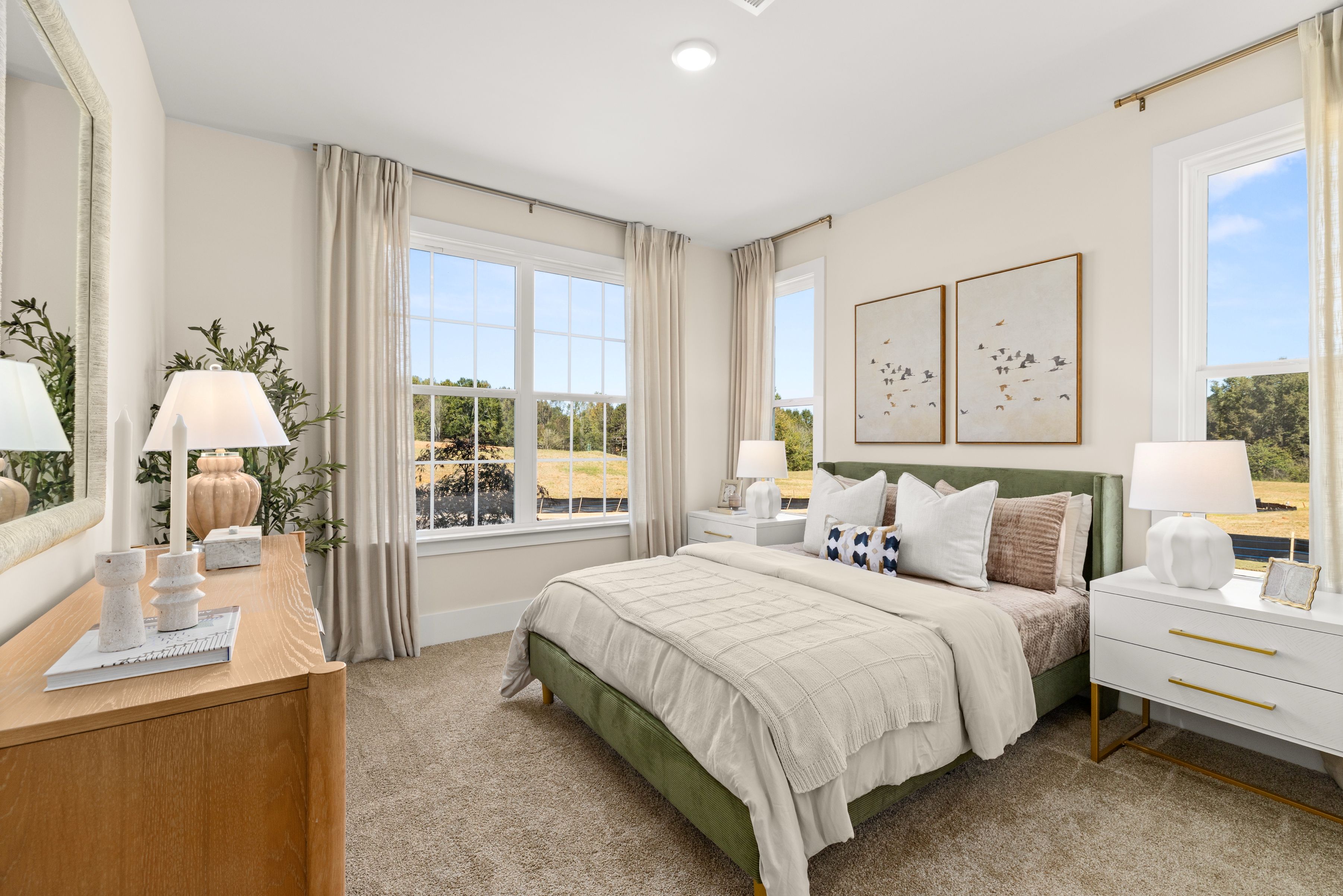 A bedroom with a bed and a desk.