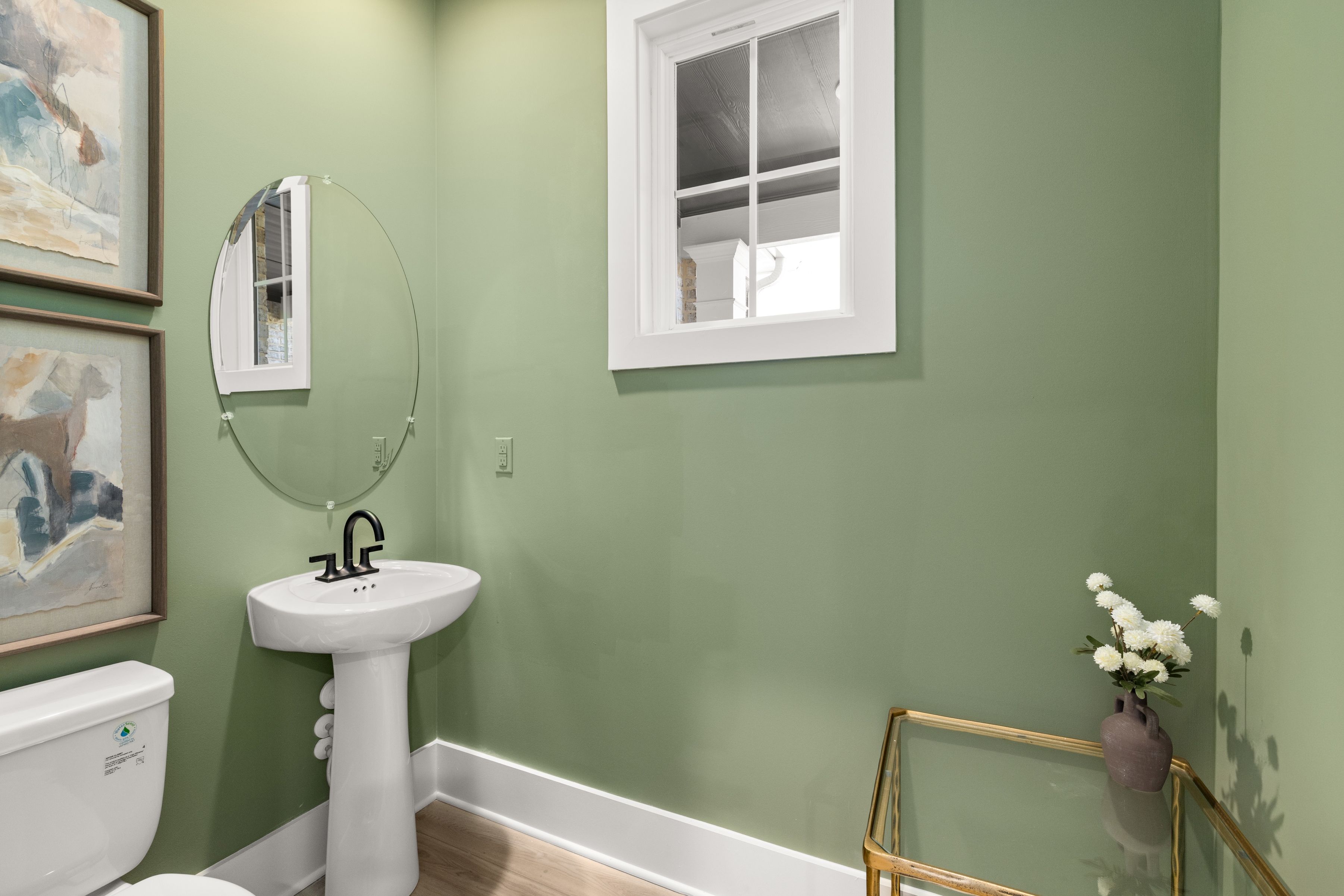 A bathroom with a sink and a mirror.