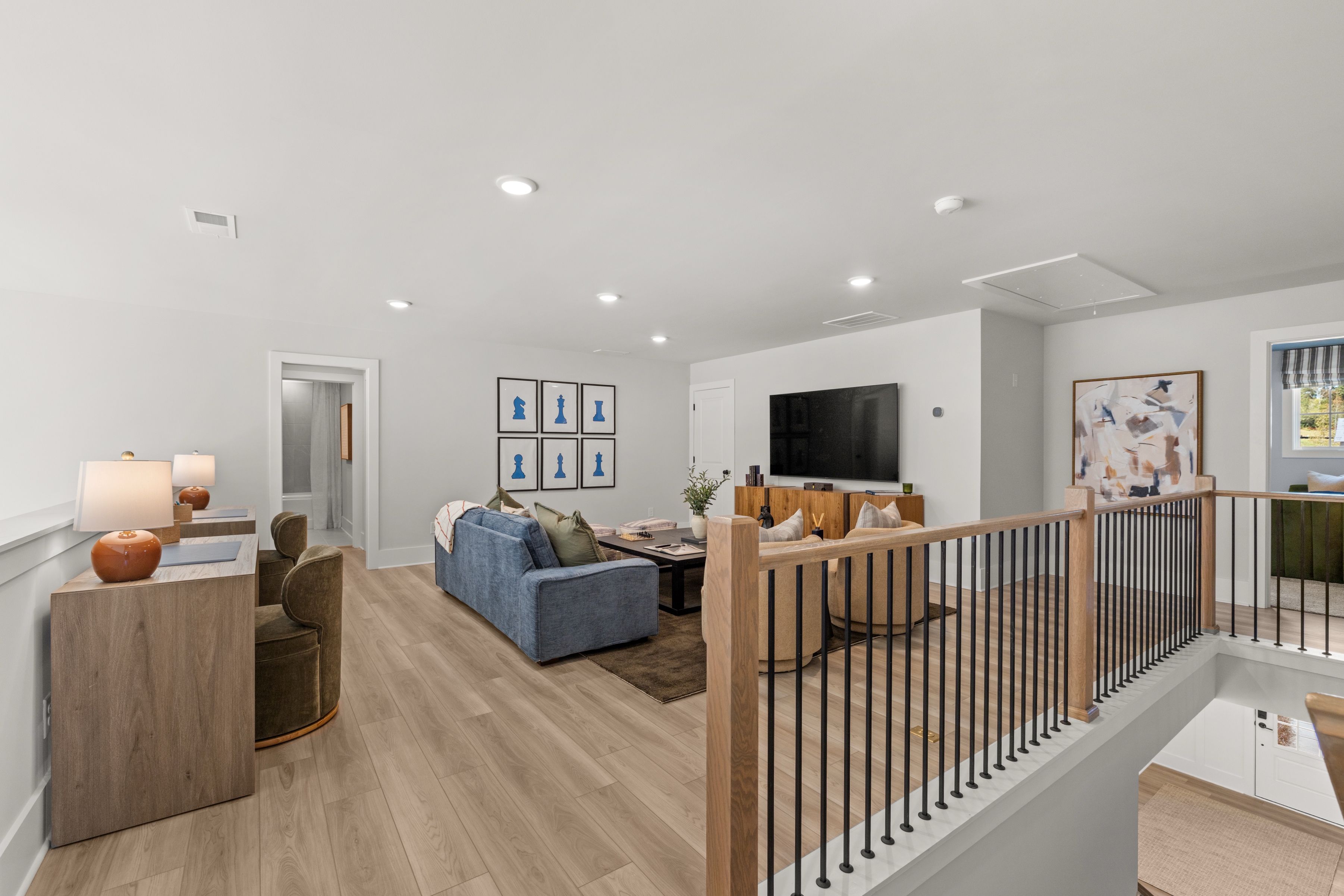A living room with a wood floor.